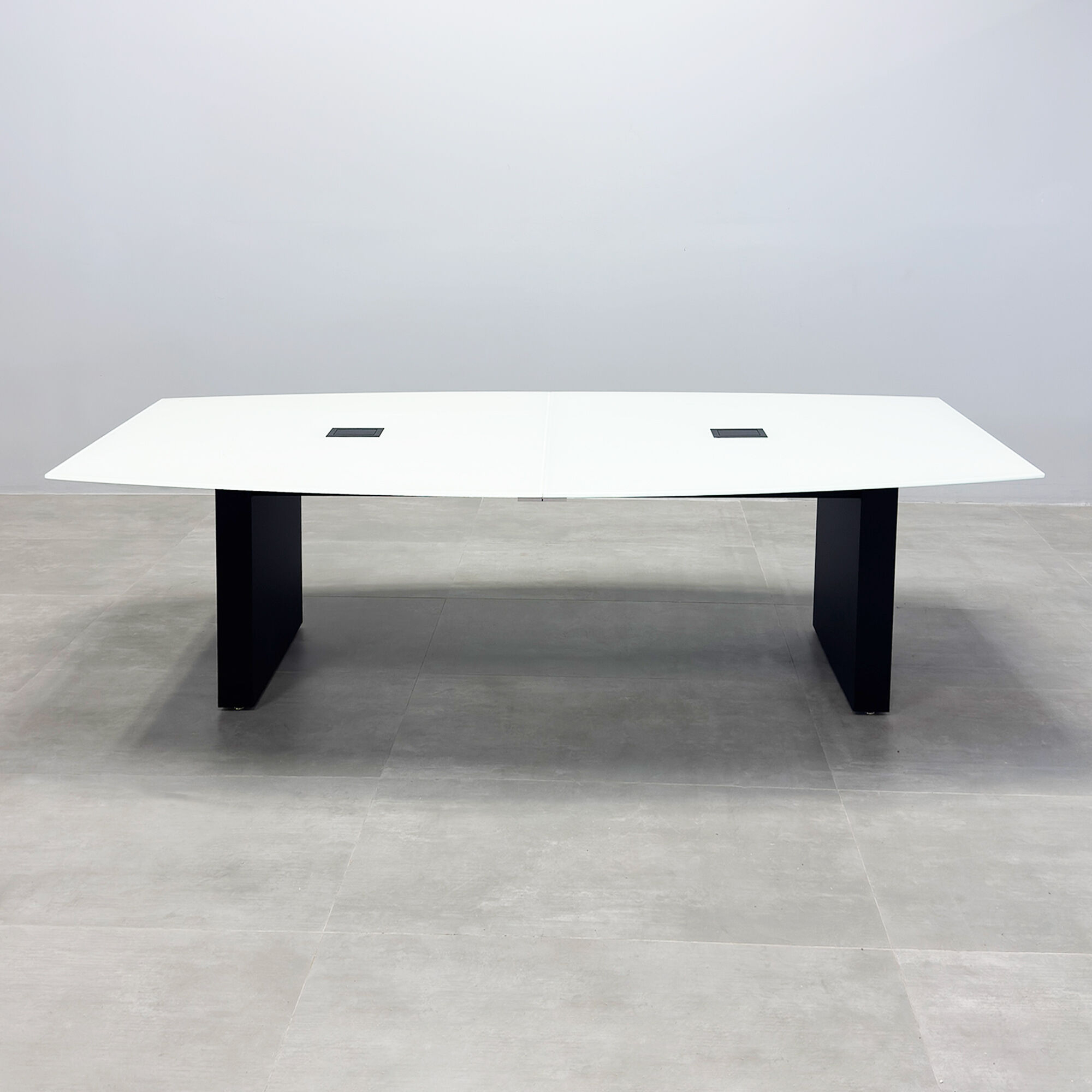 108-inch Omaha Boat Conference Table with white tempered glass top, black matte laminate base, and Mx2 x2 with two power ports, 1 USB-A port, 1 USB-C port black.