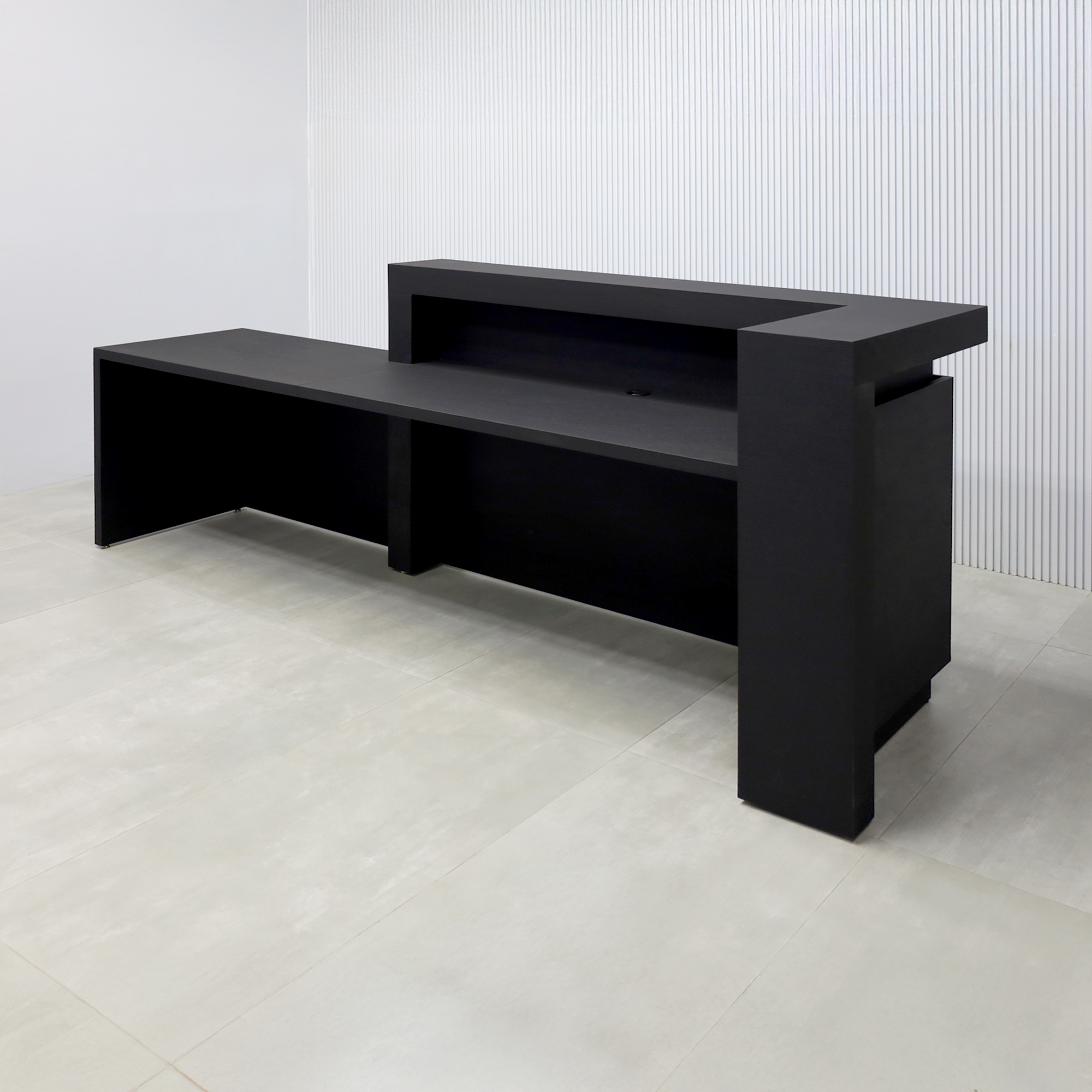 108-inch New York L ADA Reception Desk with Black Cinder Matte laminate desk, Black Cinder Matte laminate workspace, Black Cinder Matte laminate Front Panel, and Warm White LED.
