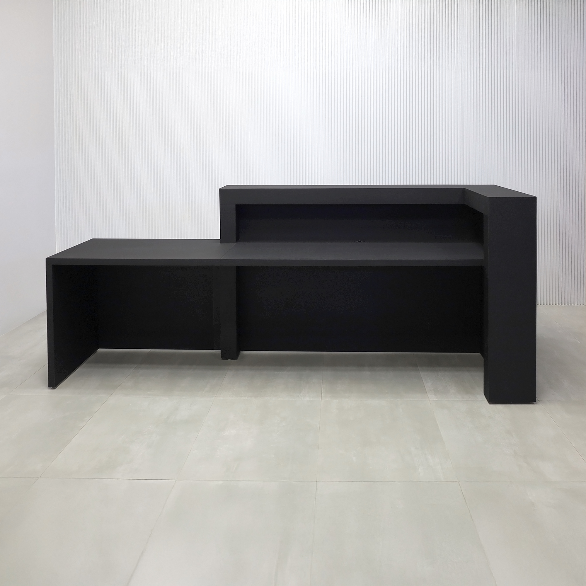 108-inch New York L ADA Reception Desk with Black Cinder Matte laminate desk, Black Cinder Matte laminate workspace, Black Cinder Matte laminate Front Panel, and Warm White LED.