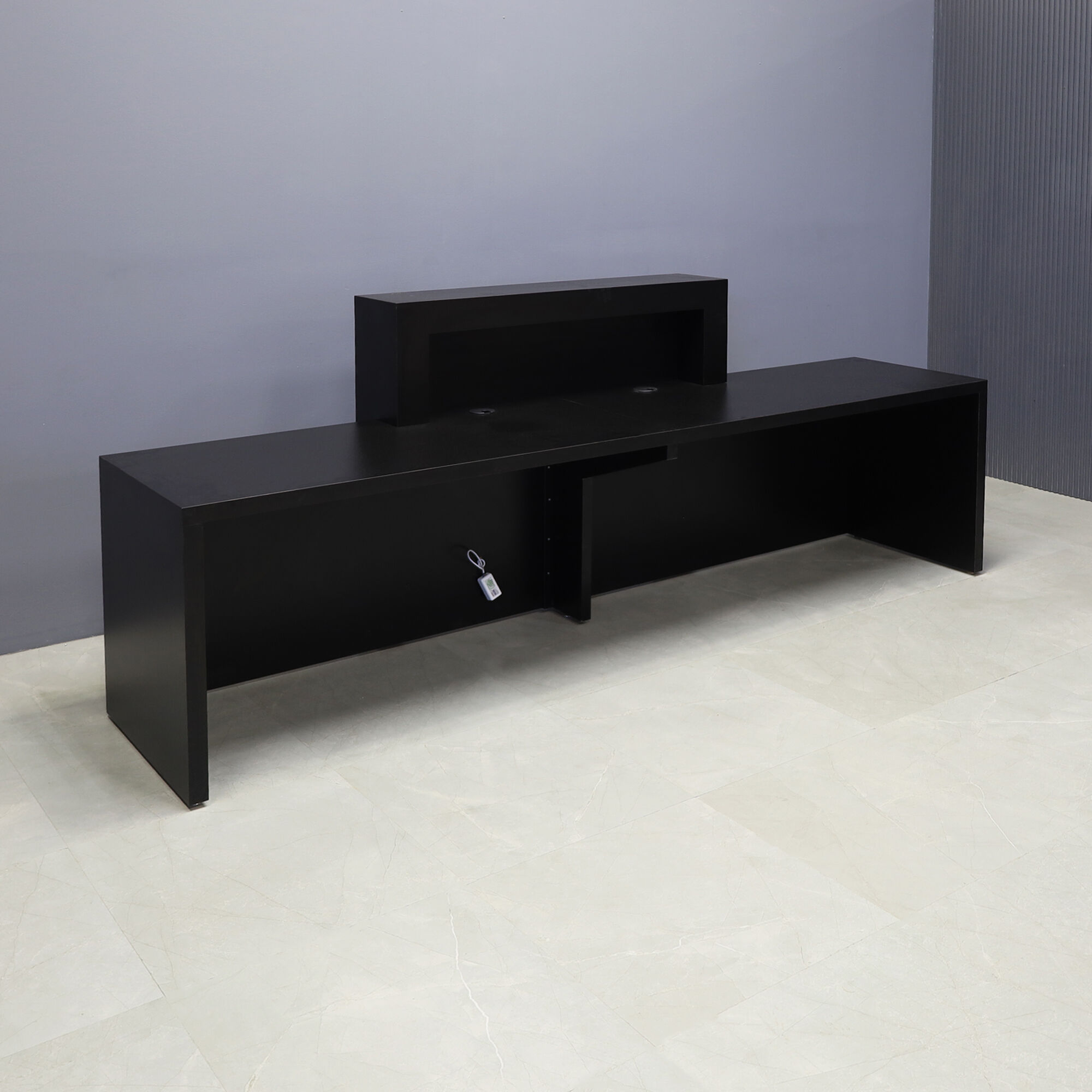 108-inch New York Extra Wide in black matte laminate main desk, front panel & recessed accent, and color changing LED.