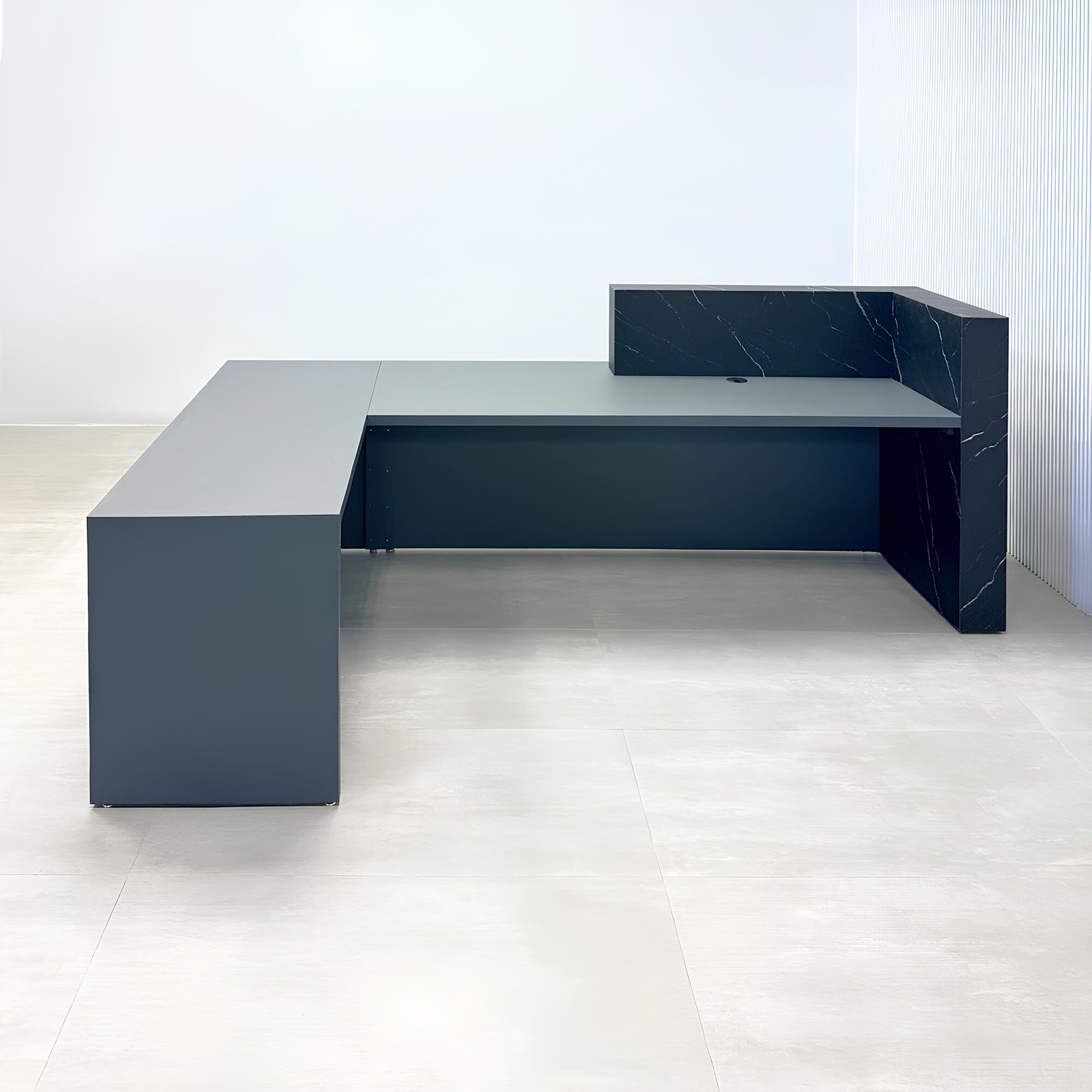 108-inch Atlanta L Reception desk with gray traceless laminate desk, base, and return. Counter top and front accent in black stone palazzo.