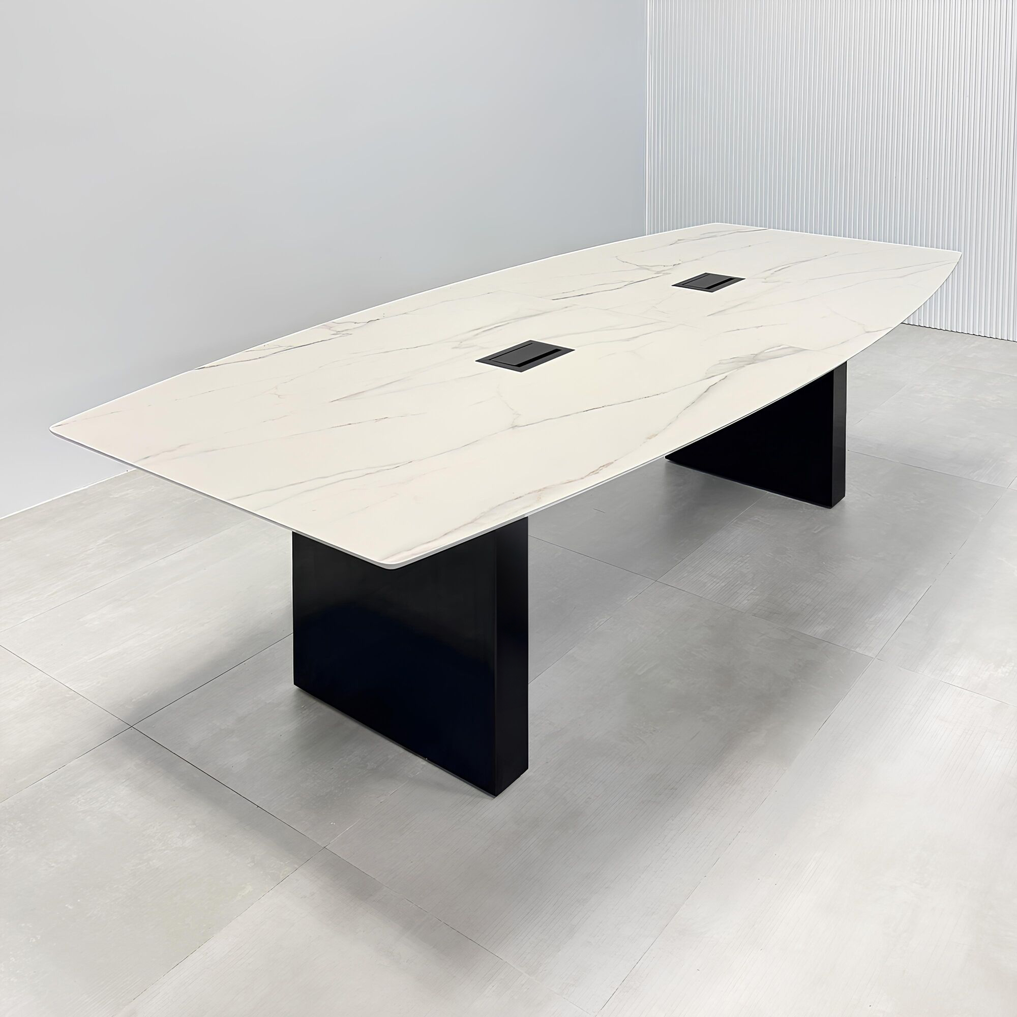 108-inch Aurora Boat Shape Conference Table with solenne marble engineered surface top, black matte laminate base, and Mx3 power box in black. 