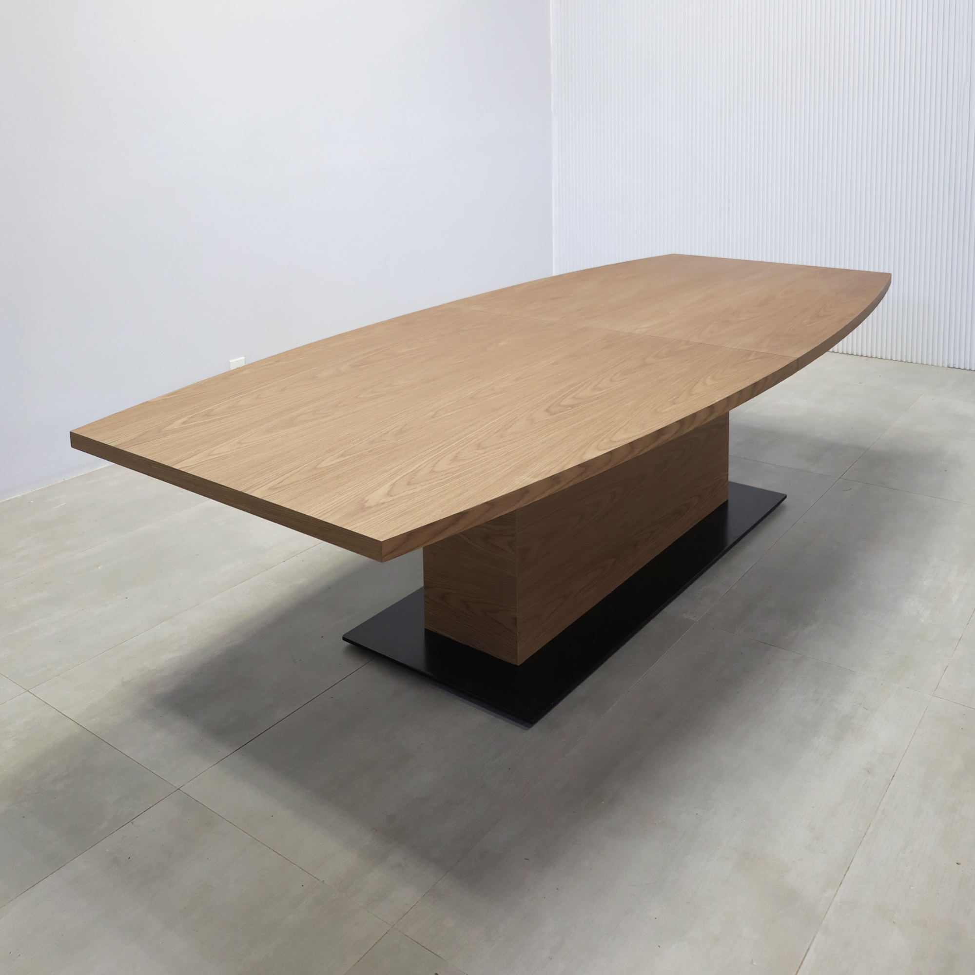 108-inch Newton Boat Conference Table with Walnut Wood Veneer top, Walnut Wood Veneer pedestal, and Black Powder-Coated base.