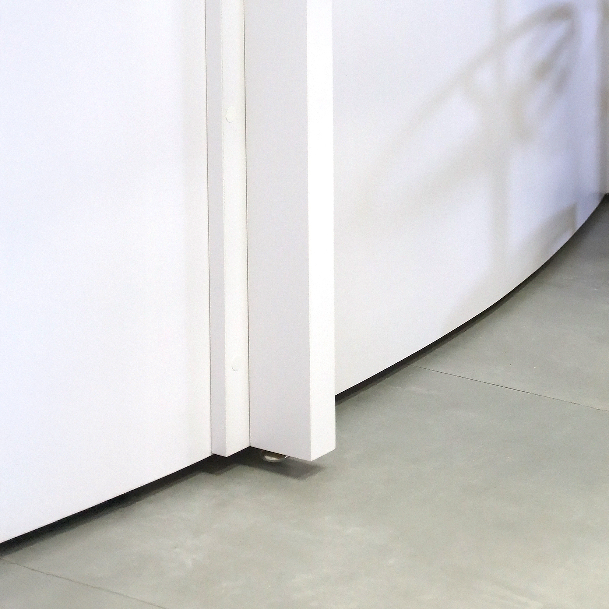 108-inch Moab Custom Podcast Table with White matte laminate top, White matte laminate base, and Fog Gray tambour front.