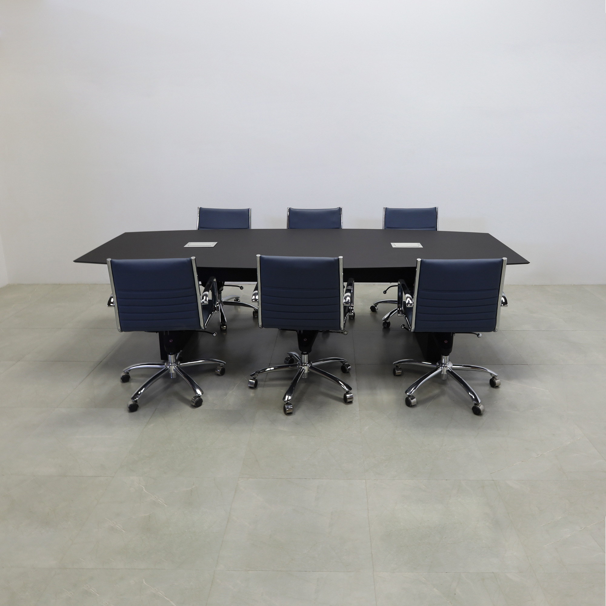 114-inch Aurora Boat Shape Conference Table in 1/2-inch black traceless engineered surface top, standard base black matte laminate, and two silver MX3 power boxes.