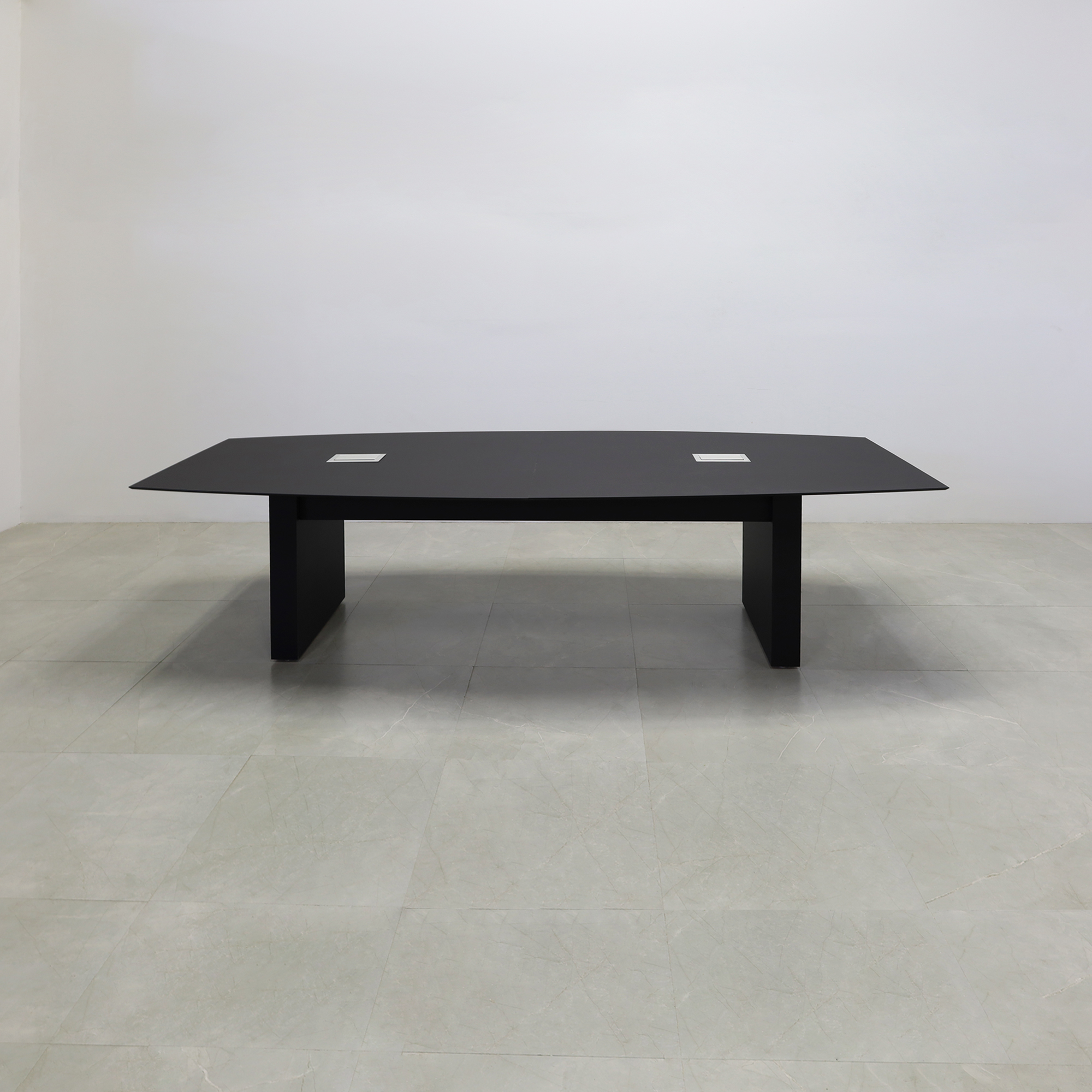 114 inches Aurora Boat Shape Conference Table with Black Traceless Engineered Stone top with two Ellora power boxes and black matte laminate base shown here. 