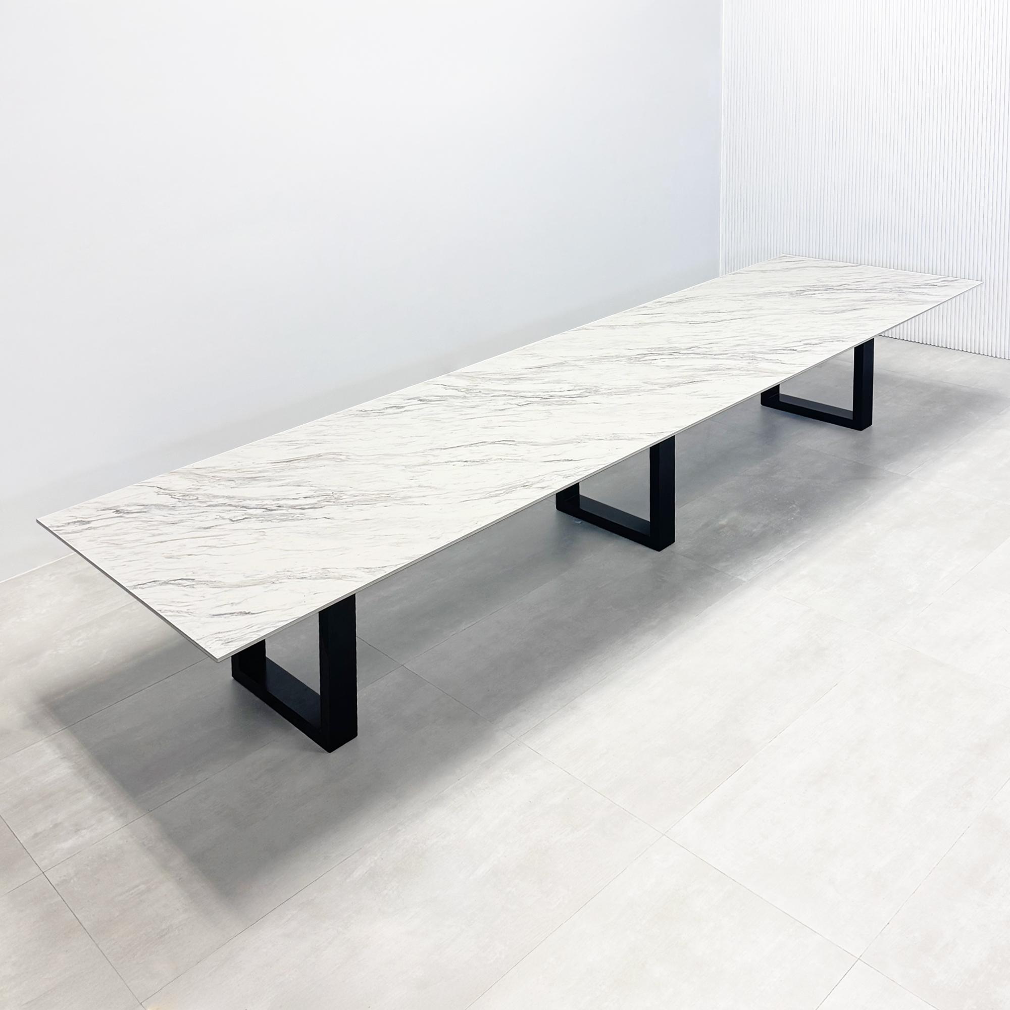 168 in x 48 in Aurora Rectangular Conference Table in 1/2-inch Calcutta Blanc engineered surface top, black powder coated U metal base.
