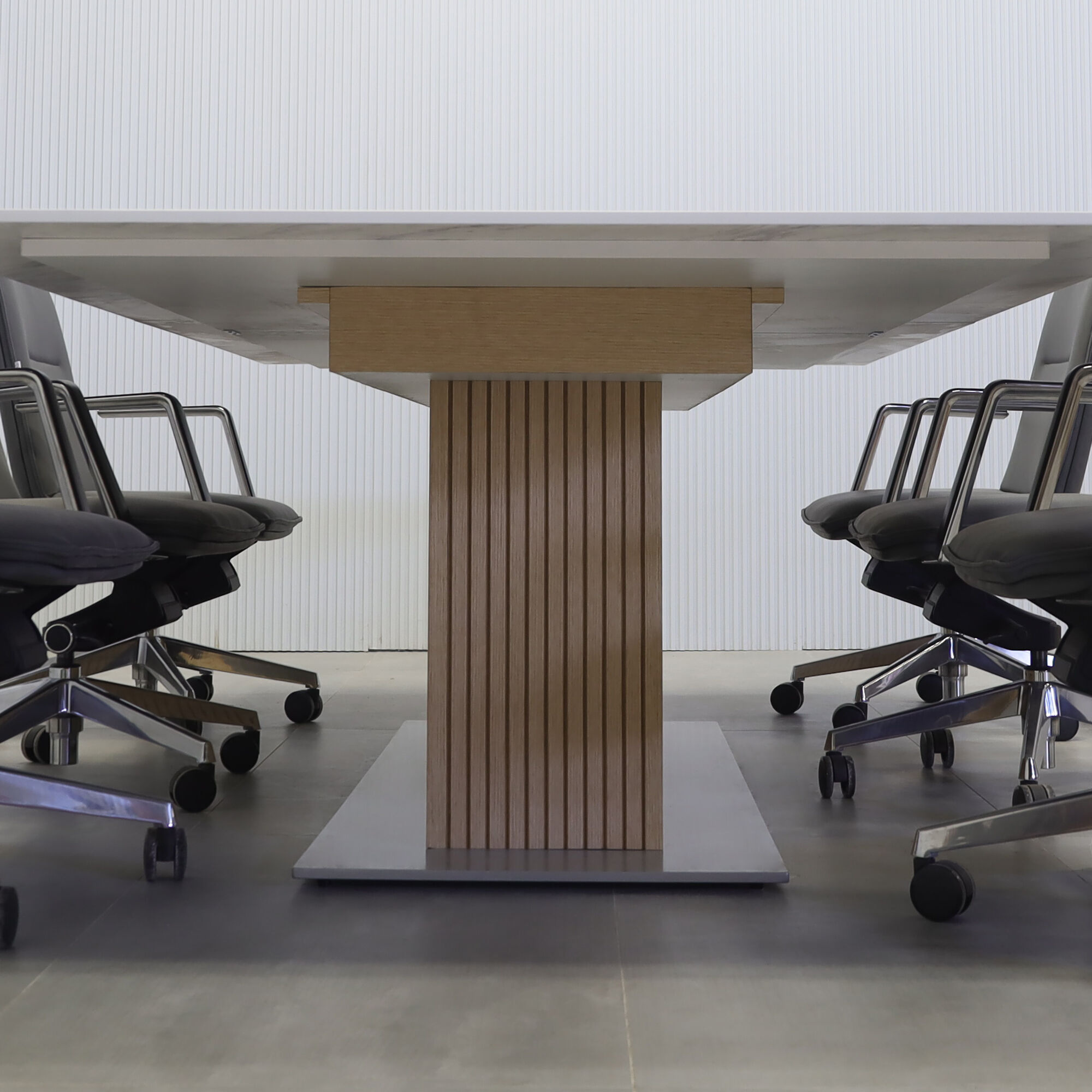 120-inches Aurora Rectangular Conference Table with calcutta engineered surface top and walnut heights tambour X3 base.