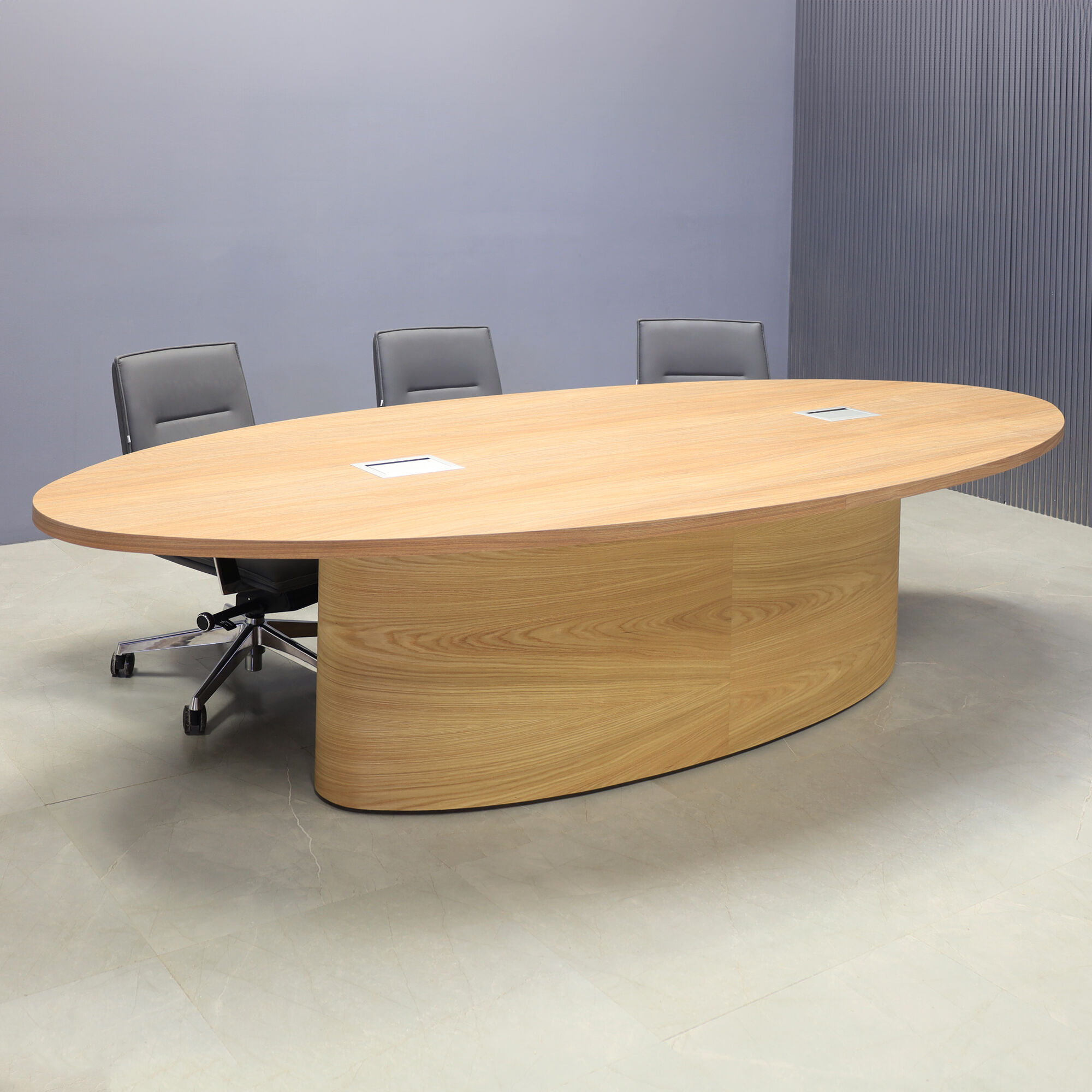 120-inch Newton Oval Conference Table with X2 base, uptown walnut laminate top, white oak veneer base, and two silver Mx3 power boxes.