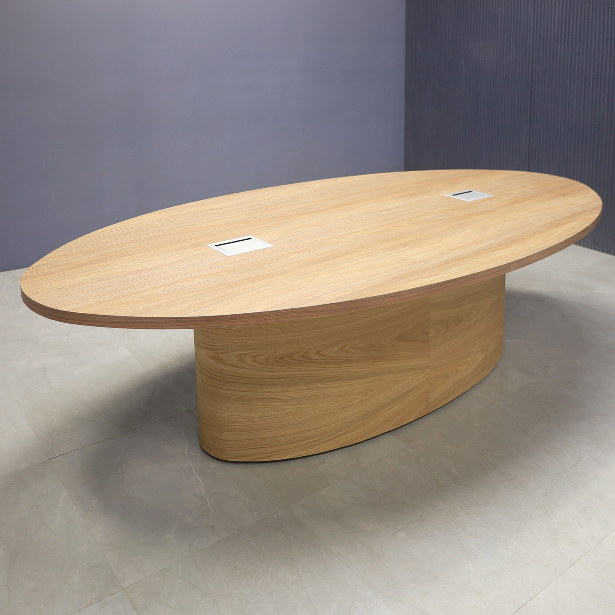 120-inch Newton Oval Conference Table with X2 base, uptown walnut laminate top, white oak veneer base, and two silver Mx3 power boxes.