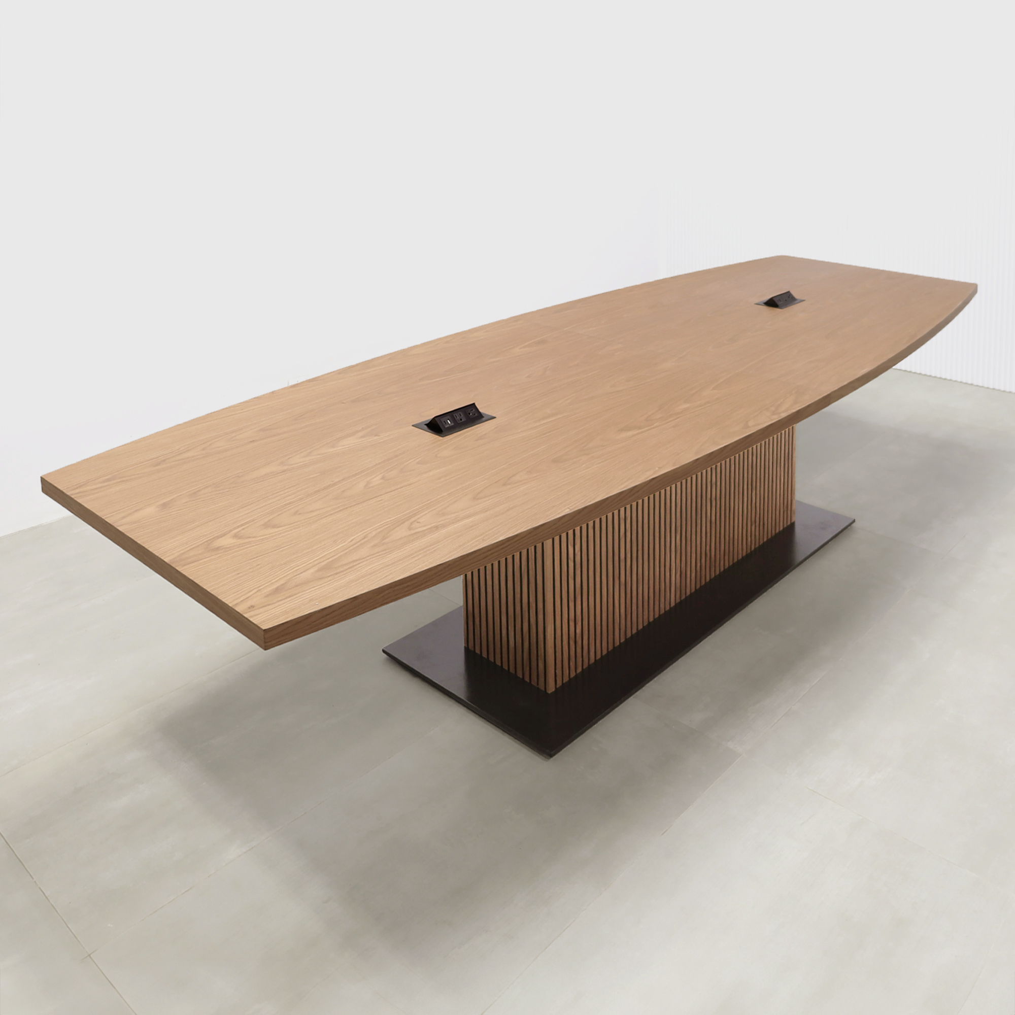 120-inch Newton Boat Conference Table with Laminate Top and X3 Base with walnut wood veneer top, walnut wood veneer tambour pedestal base, black matte laminate base, and mx2 power box in black.