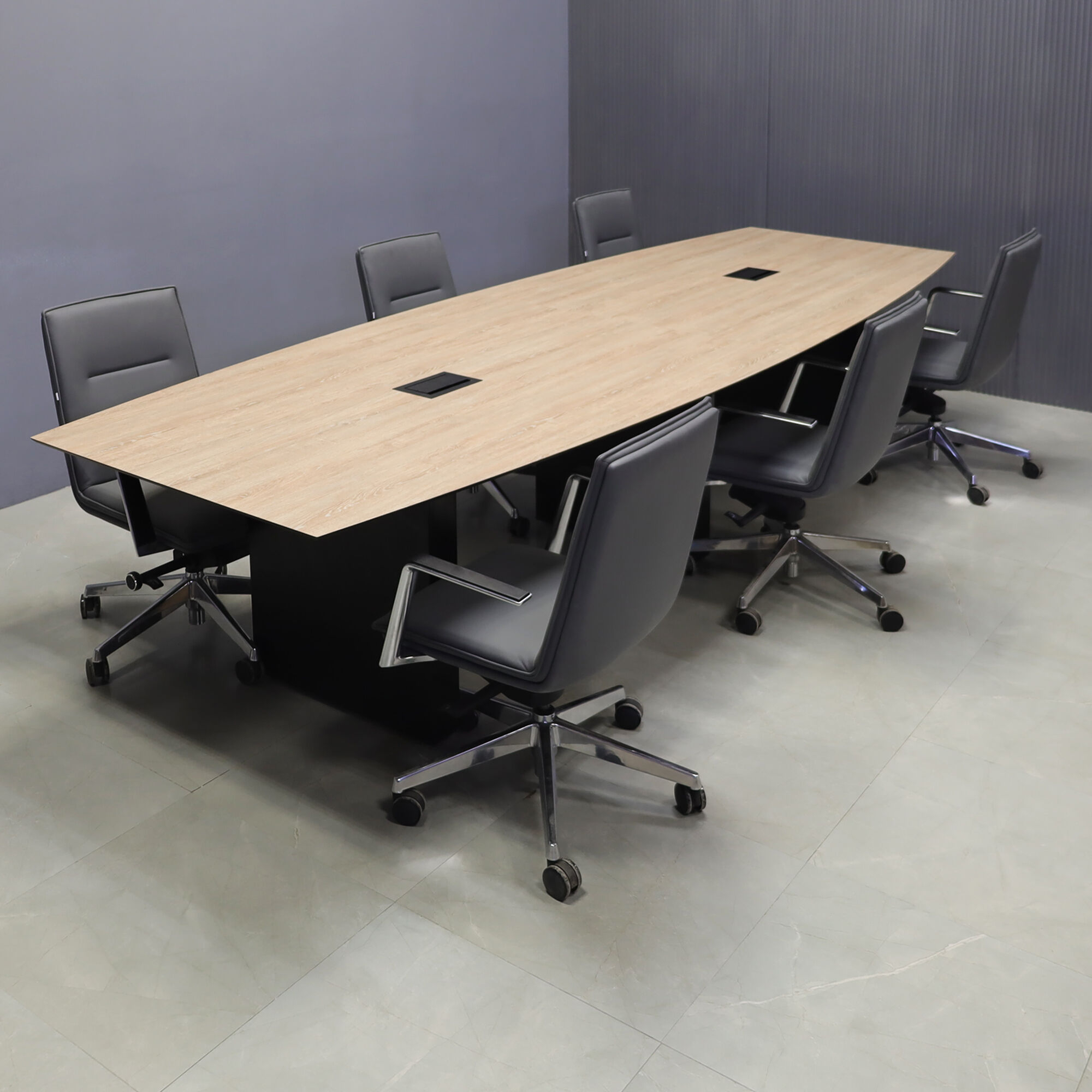 144-inch Aurora Boat Conference Table in 1/2-inch countryside oak engineered surface top, black matte laminate base, and two black MX3 power boxes.