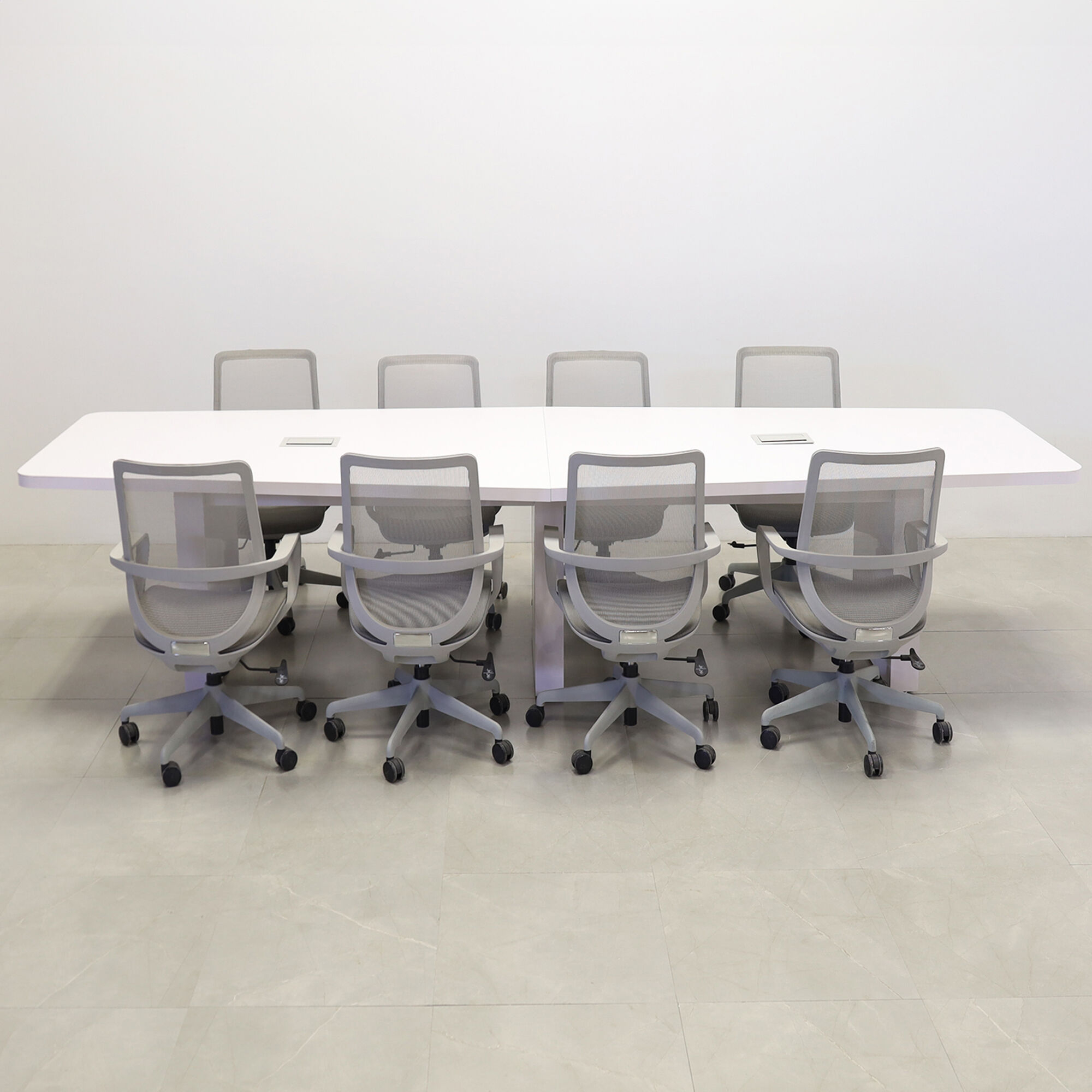 144-inch Newton Boat Conference Table in white matte laminate top & standard base, and two silver MX3 power boxes.