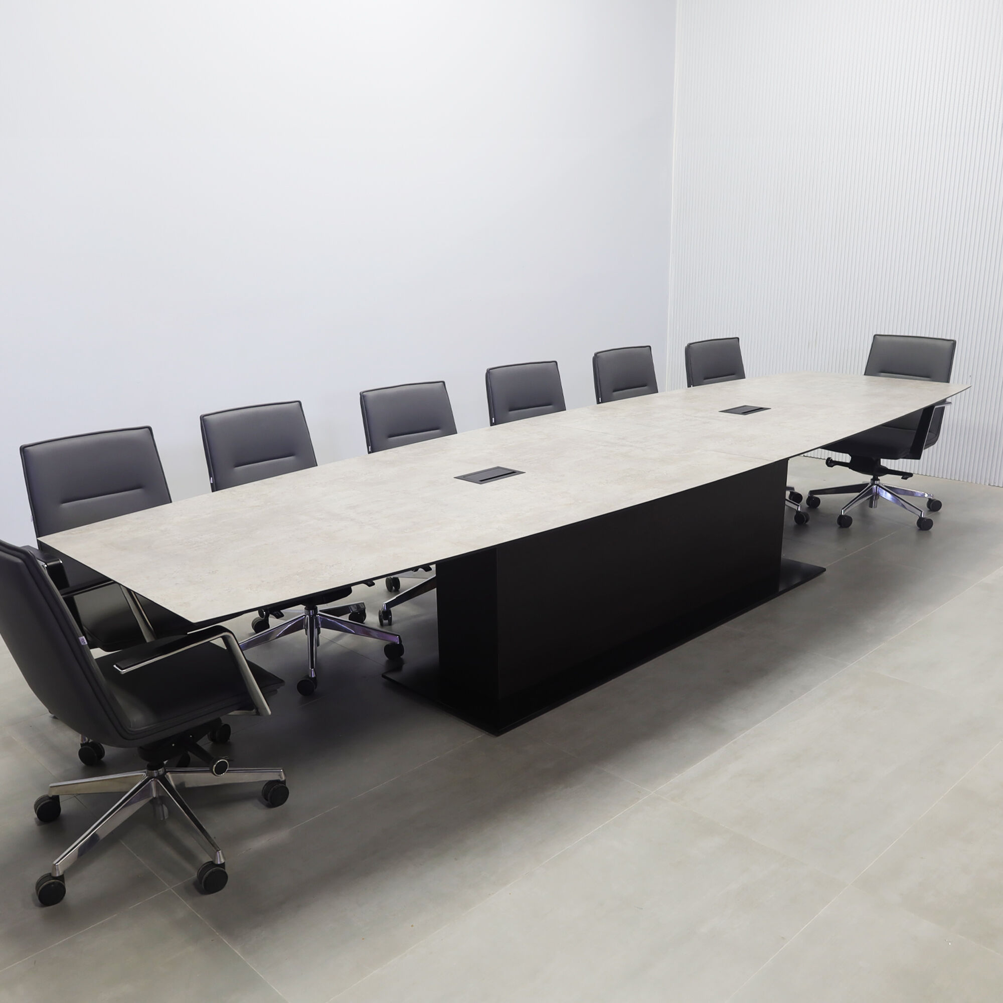 168-inches Newton Boat Shape Conference Table with industrial concrete engineered surface top, white gloss laminate pedestal, white metal base, and 2 Mx2 power boxes.