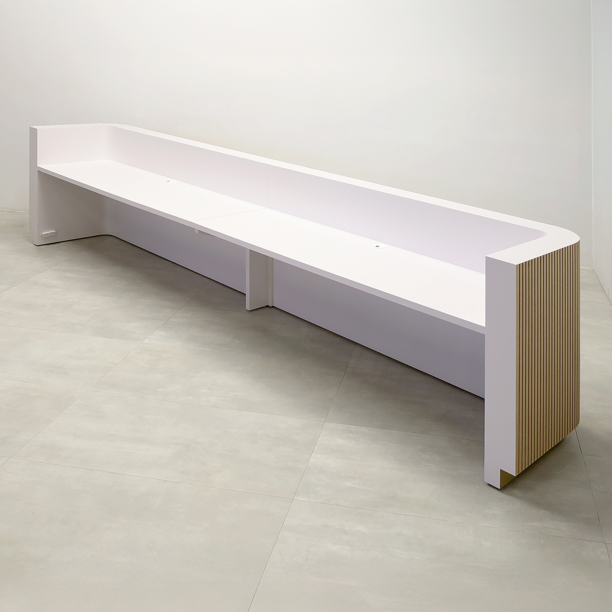 180-inch Nola Extra Large Reception Desk with White Oak tambour desk front, White matte laminate workspace, Gold Aluminum toe-kick, and Warm White LED.