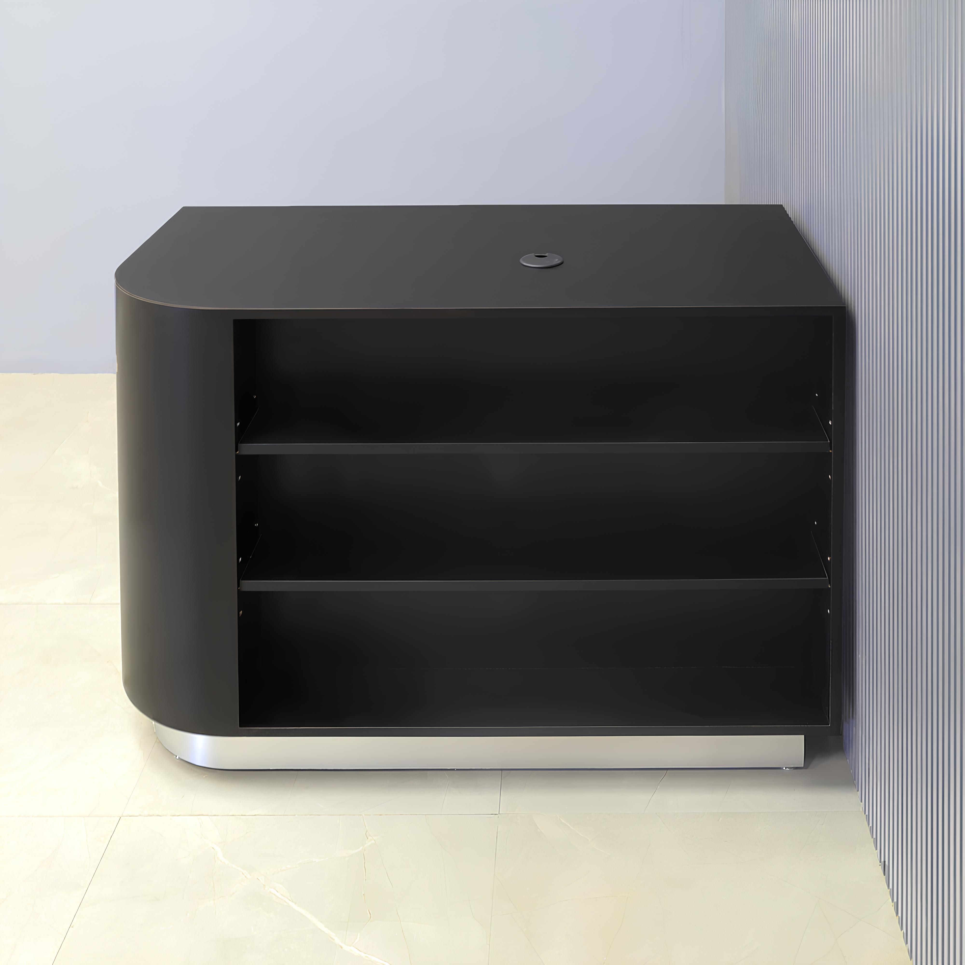 48-inch Nola Retail Custom Reception Desk in black matte laminate main desk with 2 adjustable shelves, and brushed aluminum toe-kick.