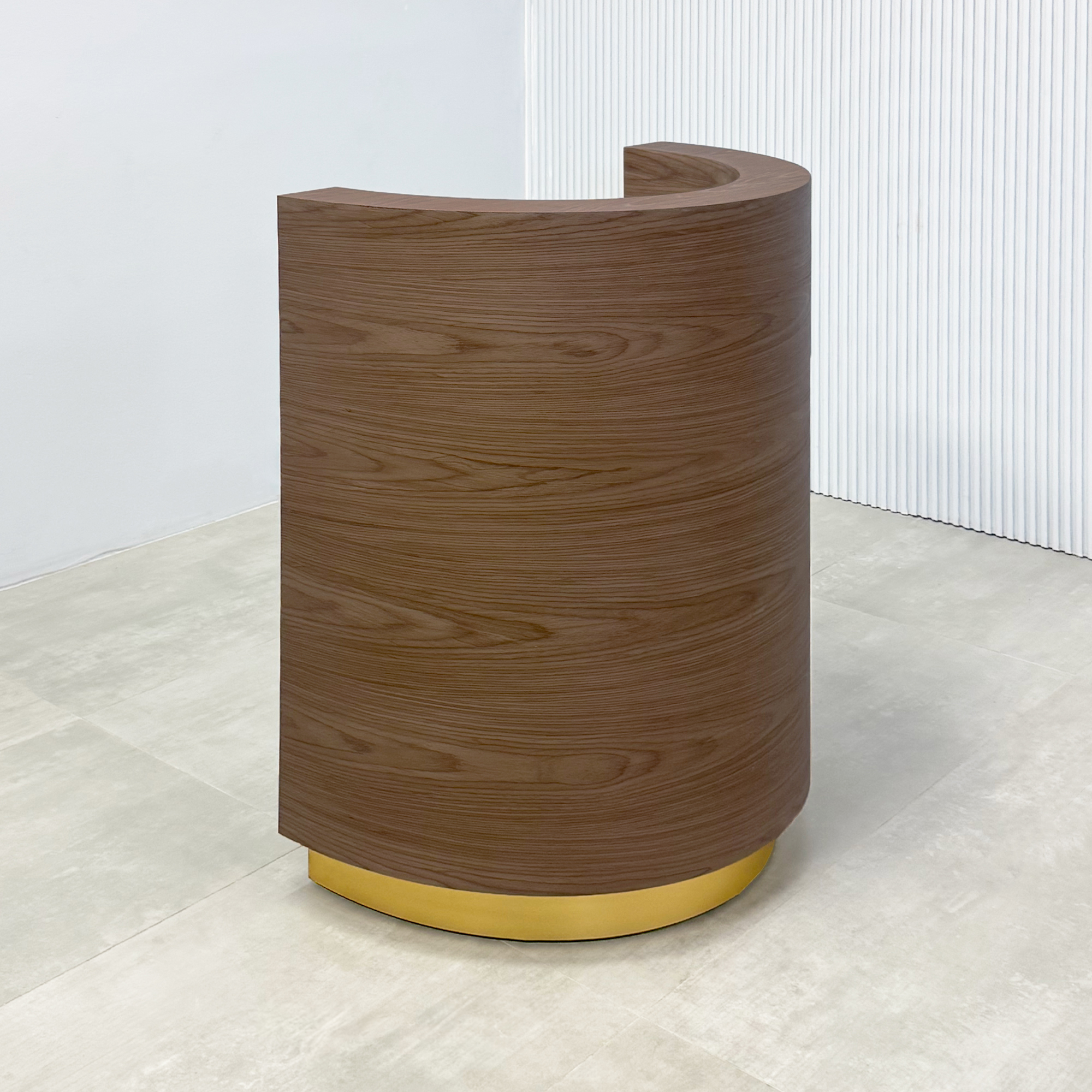Lima Round Podium & Host Custom Desk with walnut wood veneer main body, walnut wood veneer workspace, and gold aluminum toe-kick.