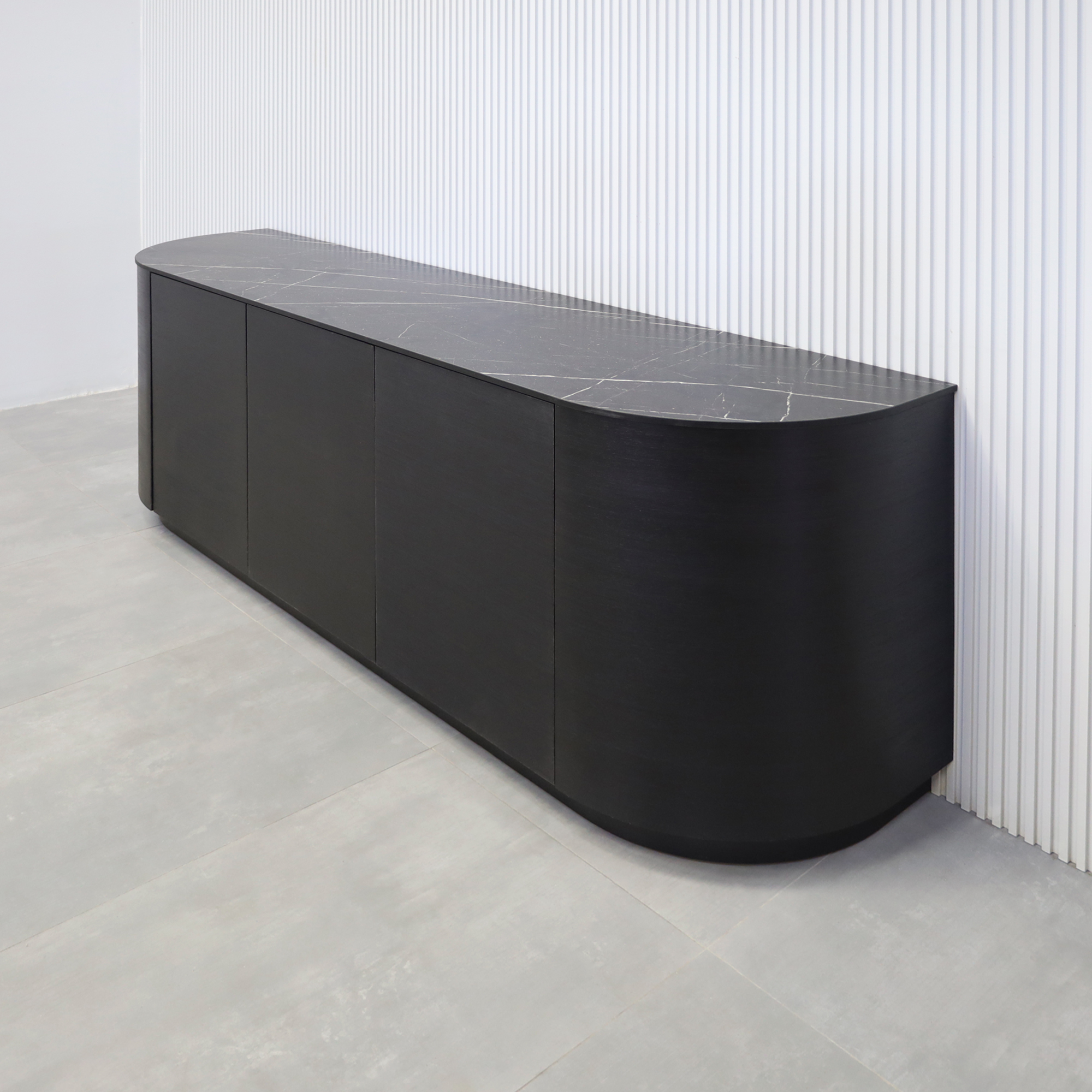 84-inch Milano Curved Storage Credenza with Pietra Noir Engineered Surface Top, Ebony wood veneer credenza & doors, and Ebony wood veener toe-kick.