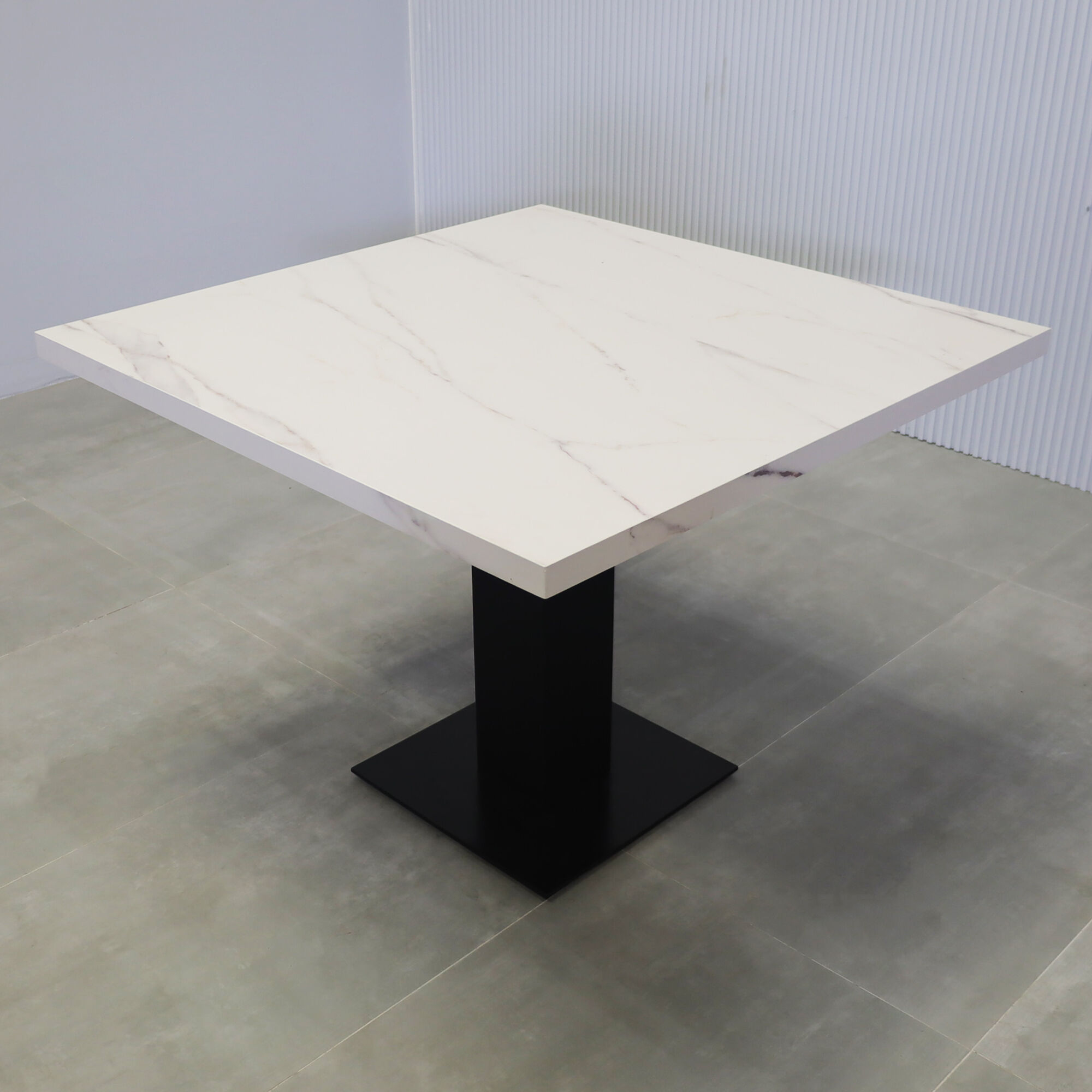 40-inch California X2 Round Conference Table in 1 1/2-inch solenne marble engineered surface top, black traceless laminate pedestal, metal powder coated base in black.