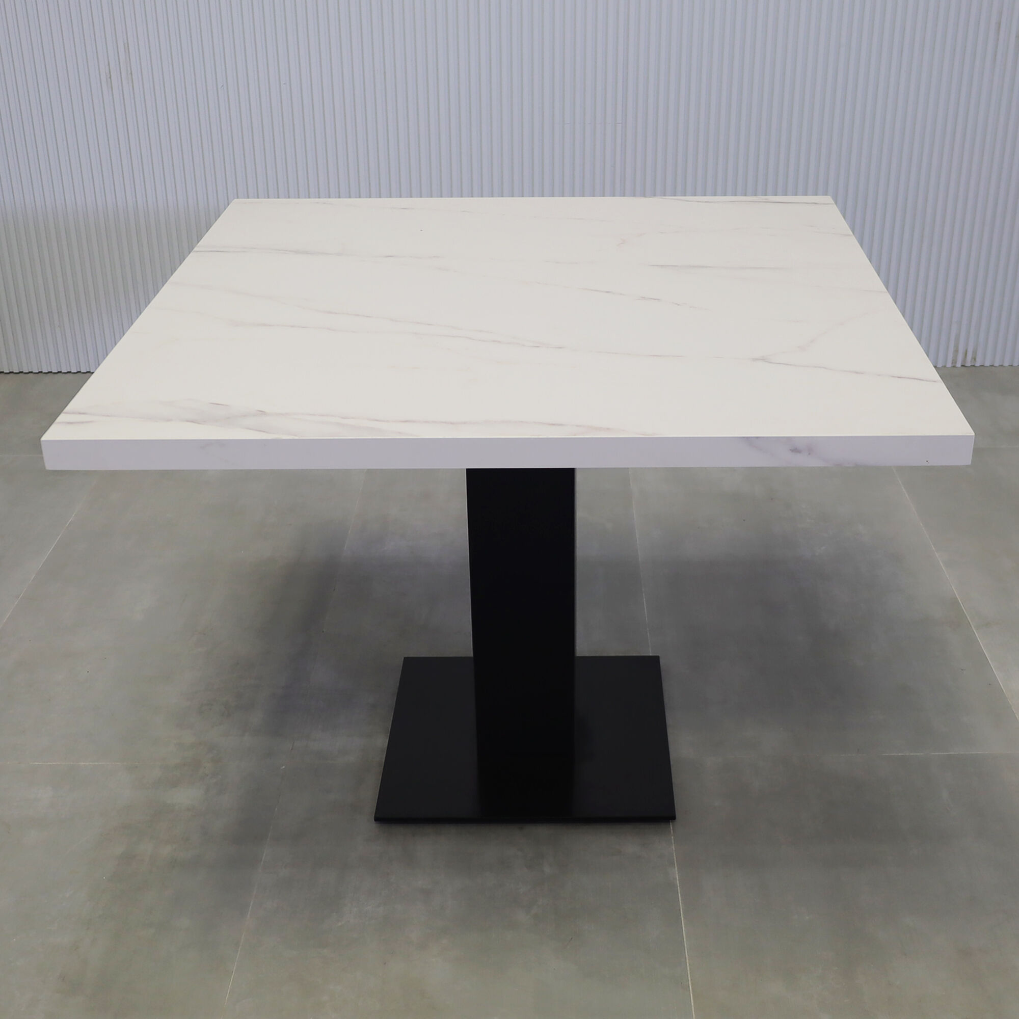 40-inch California X2 Round Conference Table in 1 1/2-inch solenne marble engineered surface top, black traceless laminate pedestal, metal powder coated base in black.