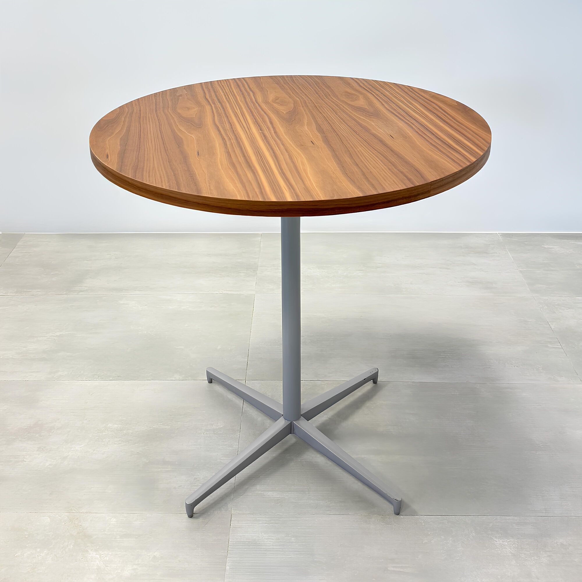 42-inch Newton Round Conference Table with Star Base in walnut veneer top, and star base in silver powder coated.