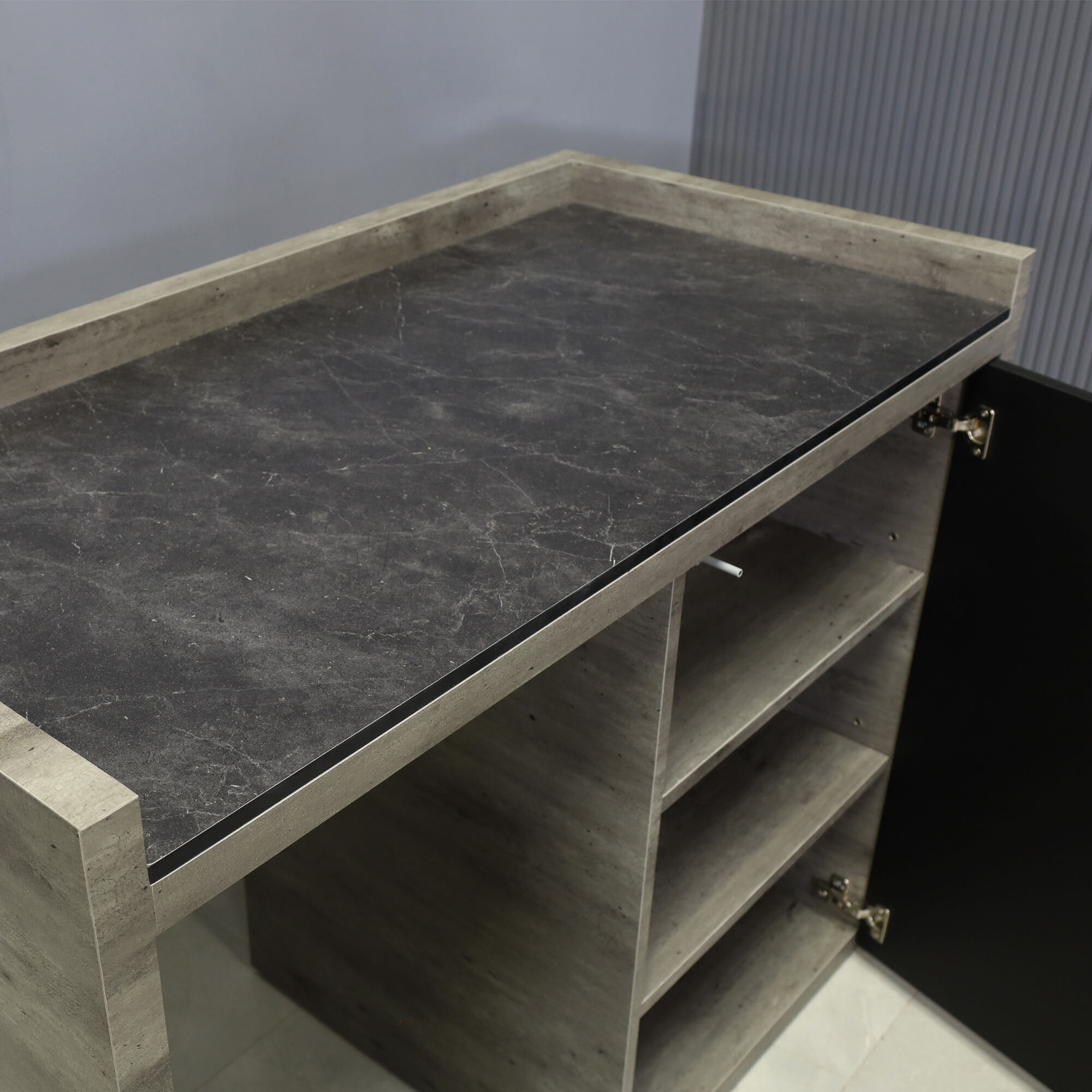 48-inch Avenue Beverage Server Station with fridge on the left side, in 1/2-inch black amani engineered surface top, metropolitan concrete PVC station, and black traceless laminate doors.