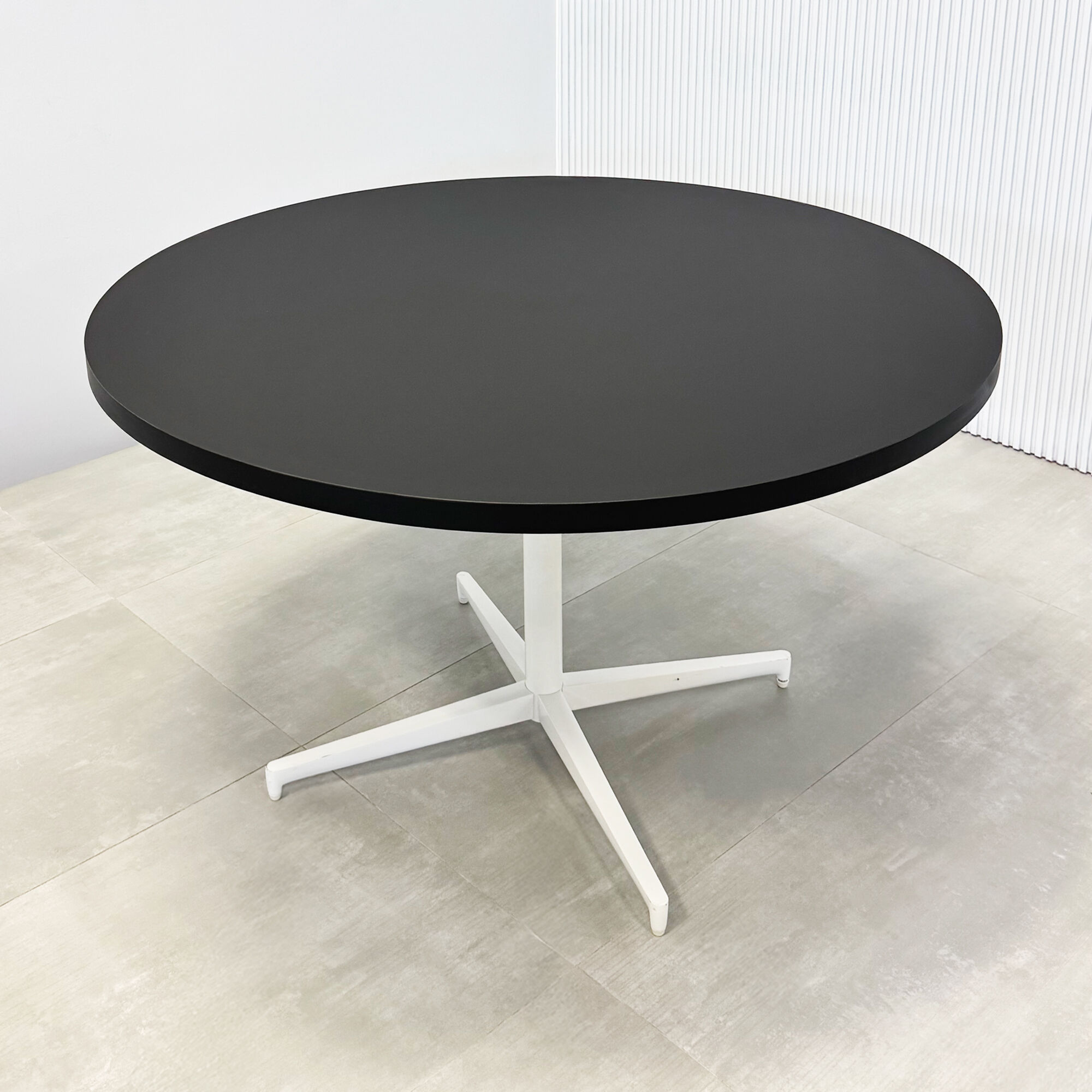 48-inch Newton Round Conference Table w Star Base in black traceless laminate top, and star base in black.