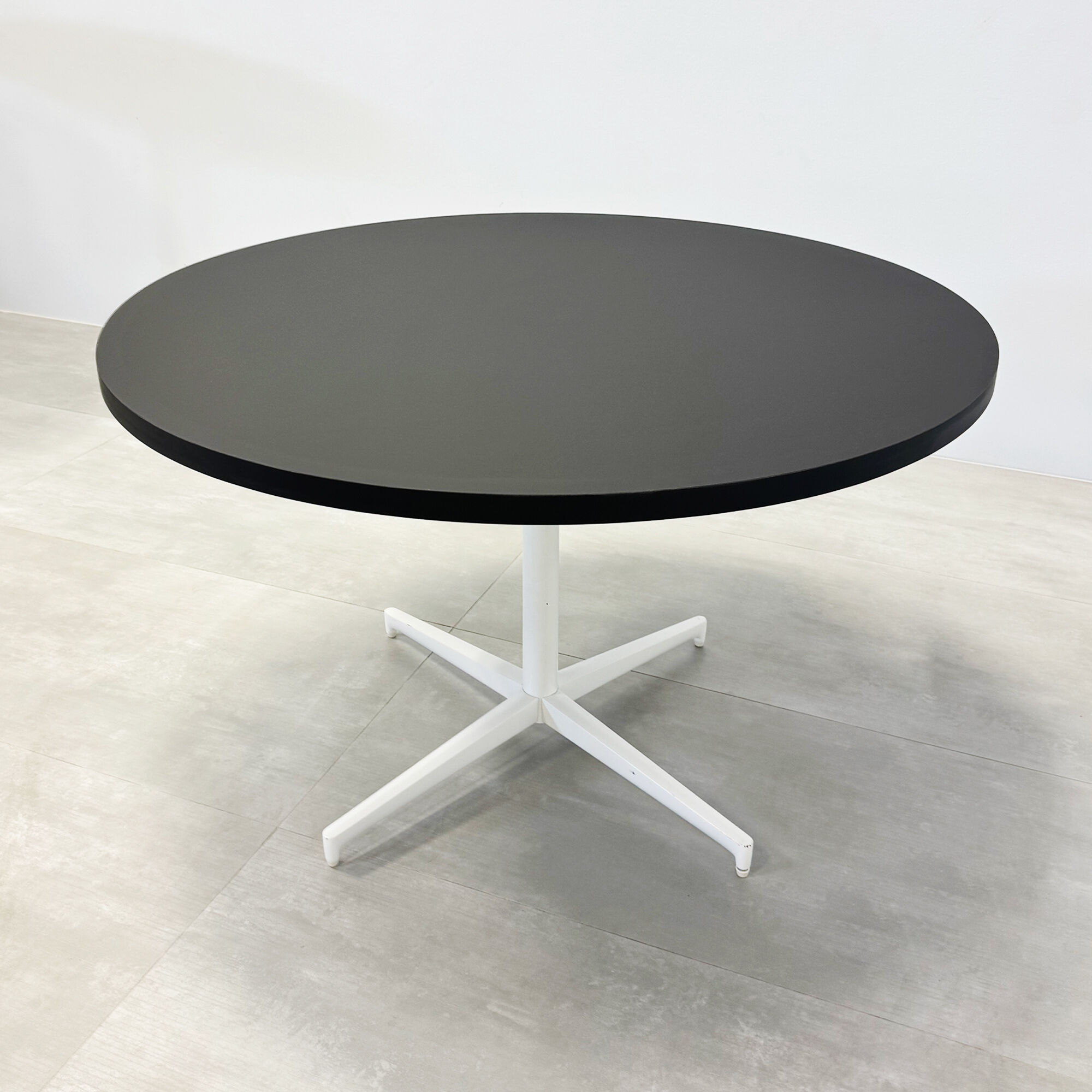 48-inch Newton Round Conference Table w Star Base in black traceless laminate top, and star base in black.