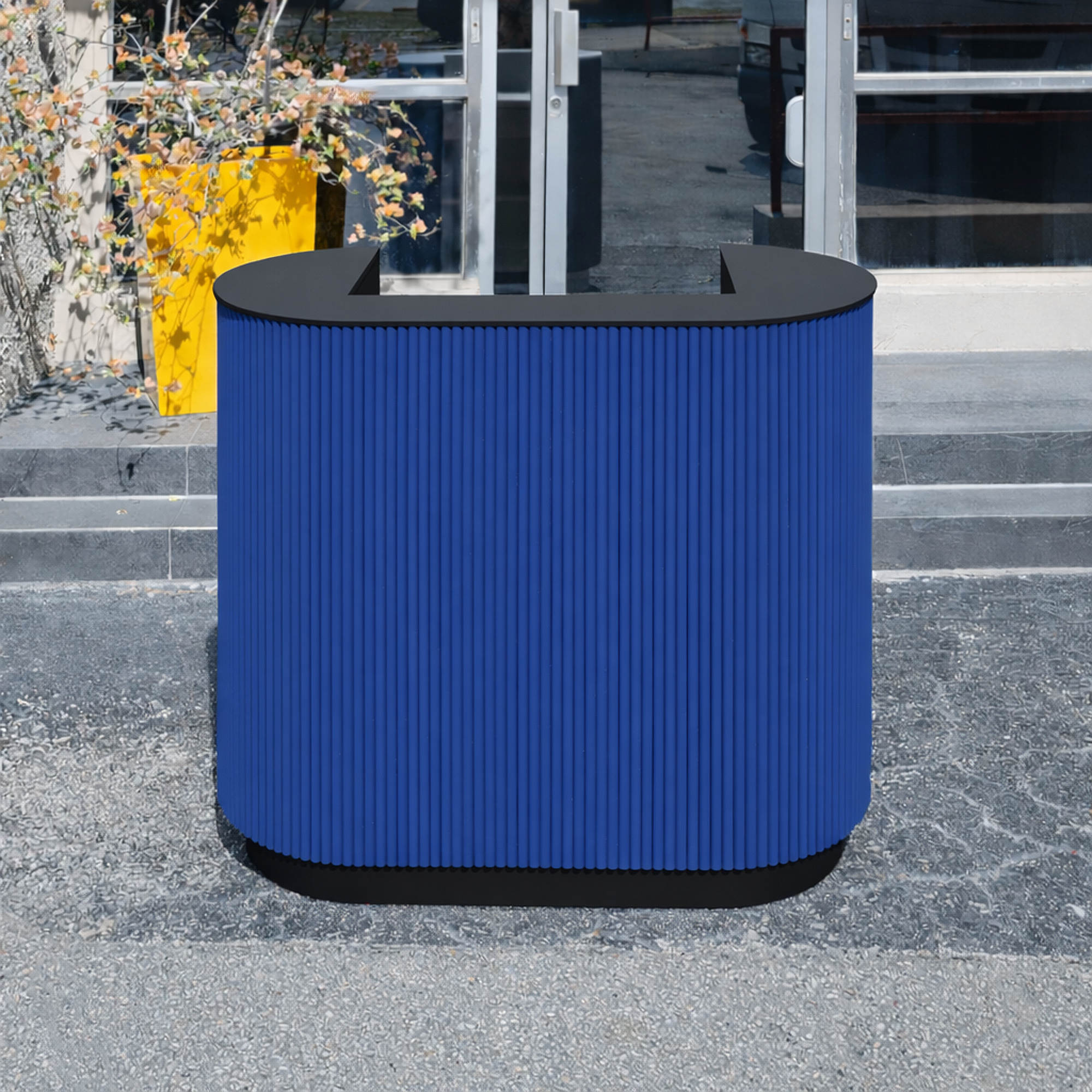 48-inch The Pill X2 Podium & Host Custom Desk with Black Traceless laminate counter, and Blue Solid Wood Tambour (Special Solid Wood Tambour). Black Traceless laminate toe-kick.