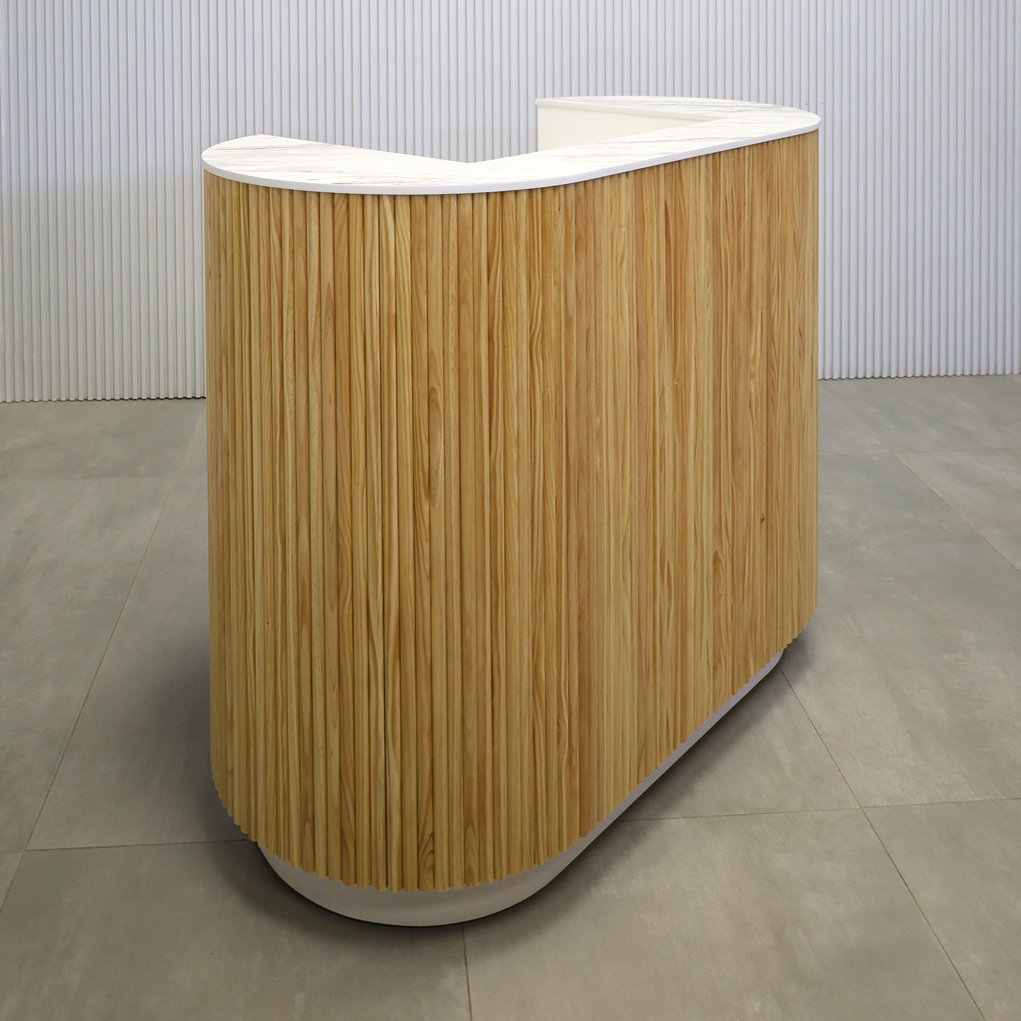 48-inch The Pill X2 Podium & Host Custom Desk with Dover Off-White matte laminate desk, and Natural Solid Wood Tambour Color. Calcutta Blanc engineered surface top, and Dover Off-White matte laminate toe-kick.