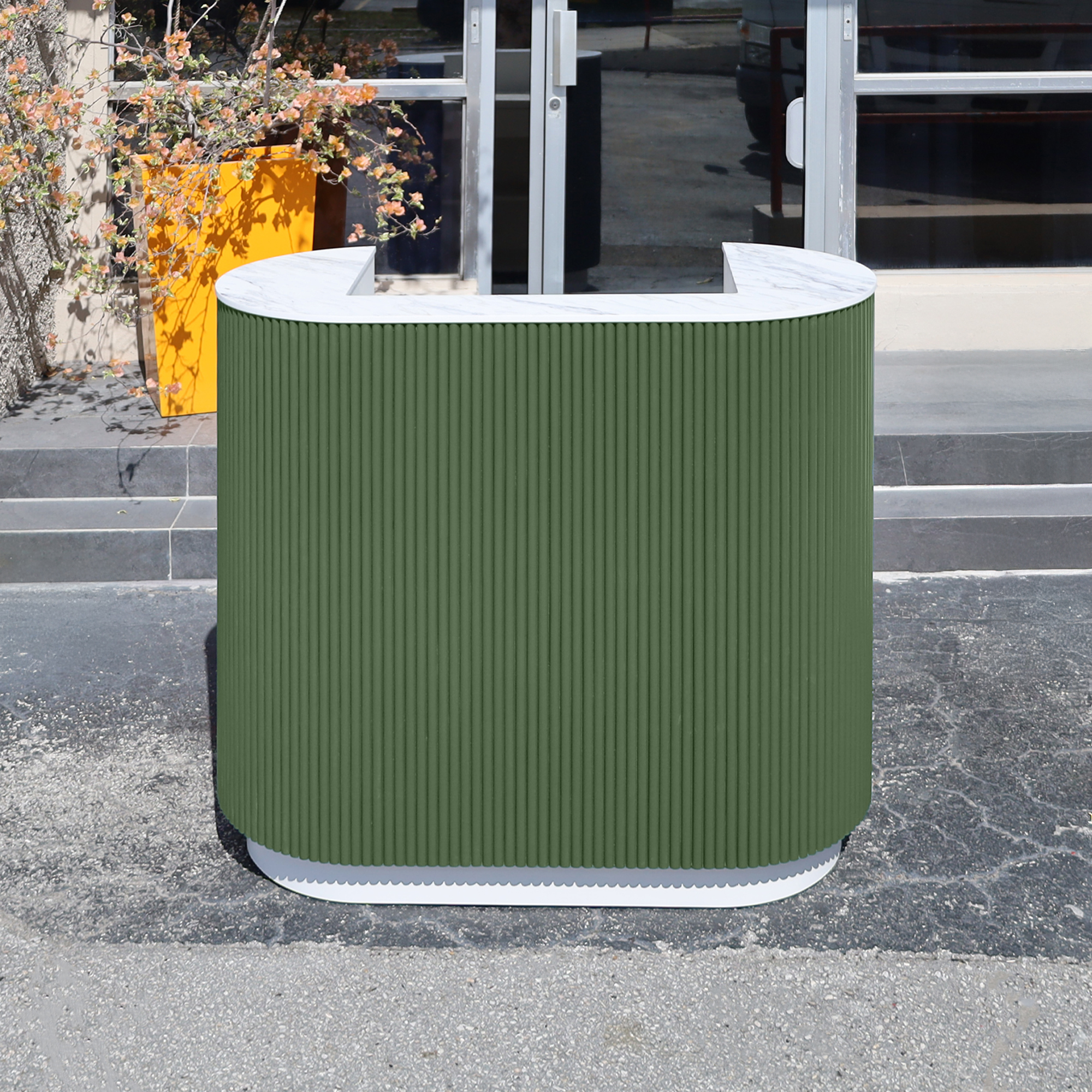 48-inch The Pill X2 Podium & Host Custom Desk with Dover Off-White matte laminate desk, and Benjamin Moore (Special Solid Wood Tambour Color). Calcutta Blanc engineered surface top, and Dover Off-White matte laminate toe-kick.