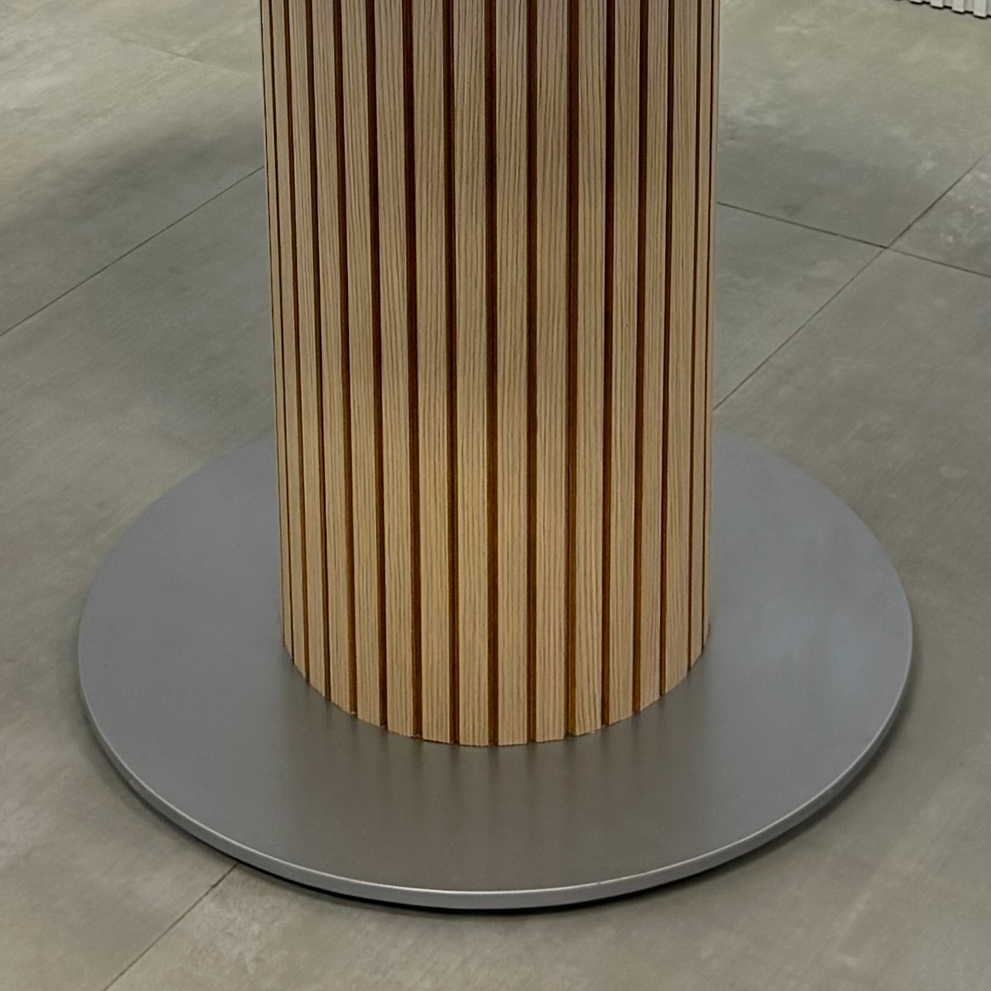 48-inch Omaha Round Conference Table with Medium Gray tempered glass top, Washed Oak tambour pedestal, Silver powder coated base, and Mx1 in White.