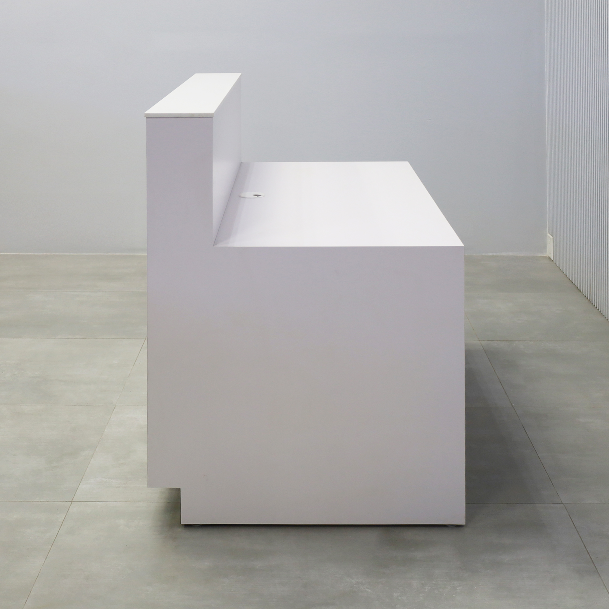 48-inch Dallas Straight Reception Desk with White Solid Engineered Surface top, White Matte laminate workspace & main body, and Brushed Aluminum toe-kick.