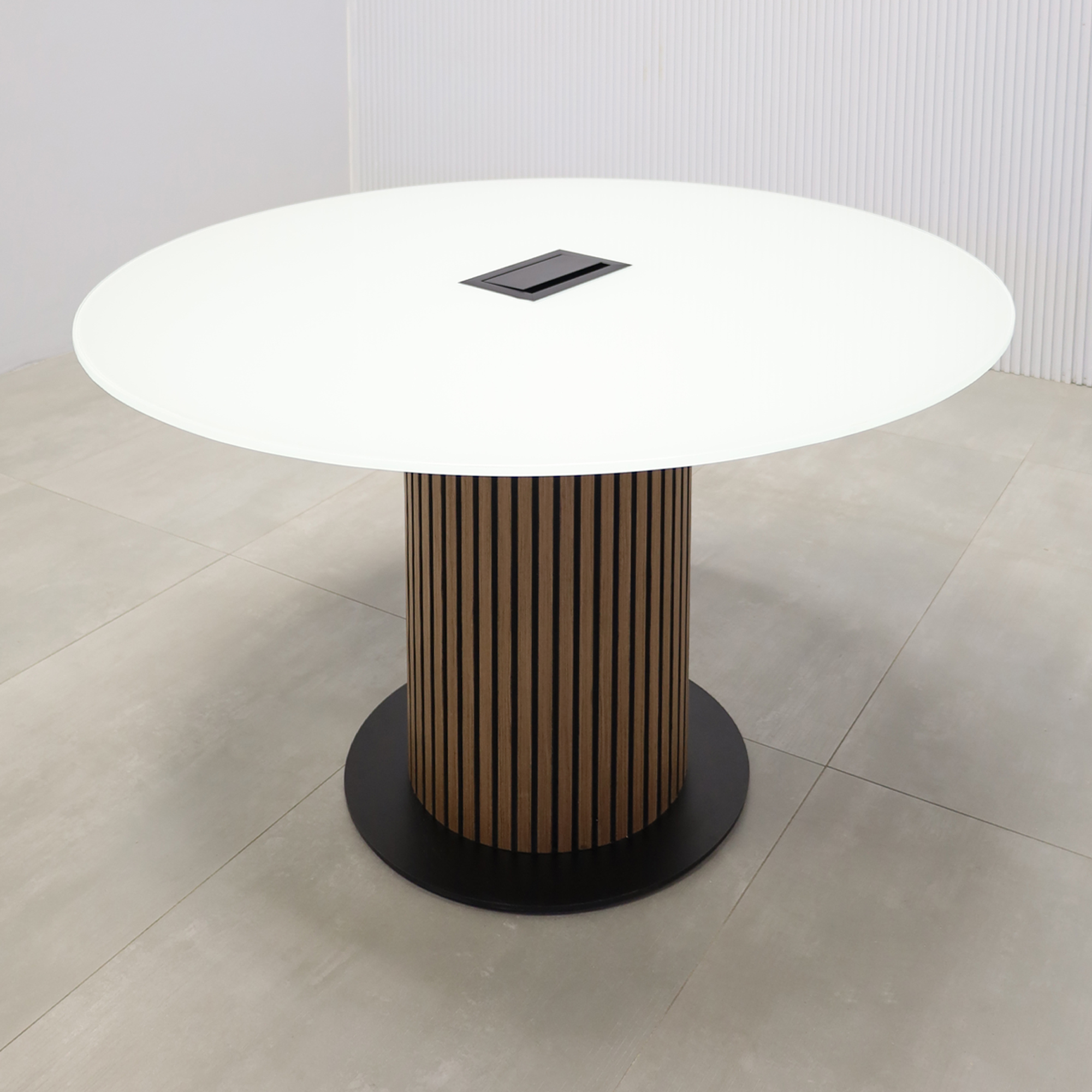 48-inch Omaha Round Conference Table with a white tempered glass top, spiced walnut veneer & black background tambour pedestal, featuring a black metal powder-coated base.