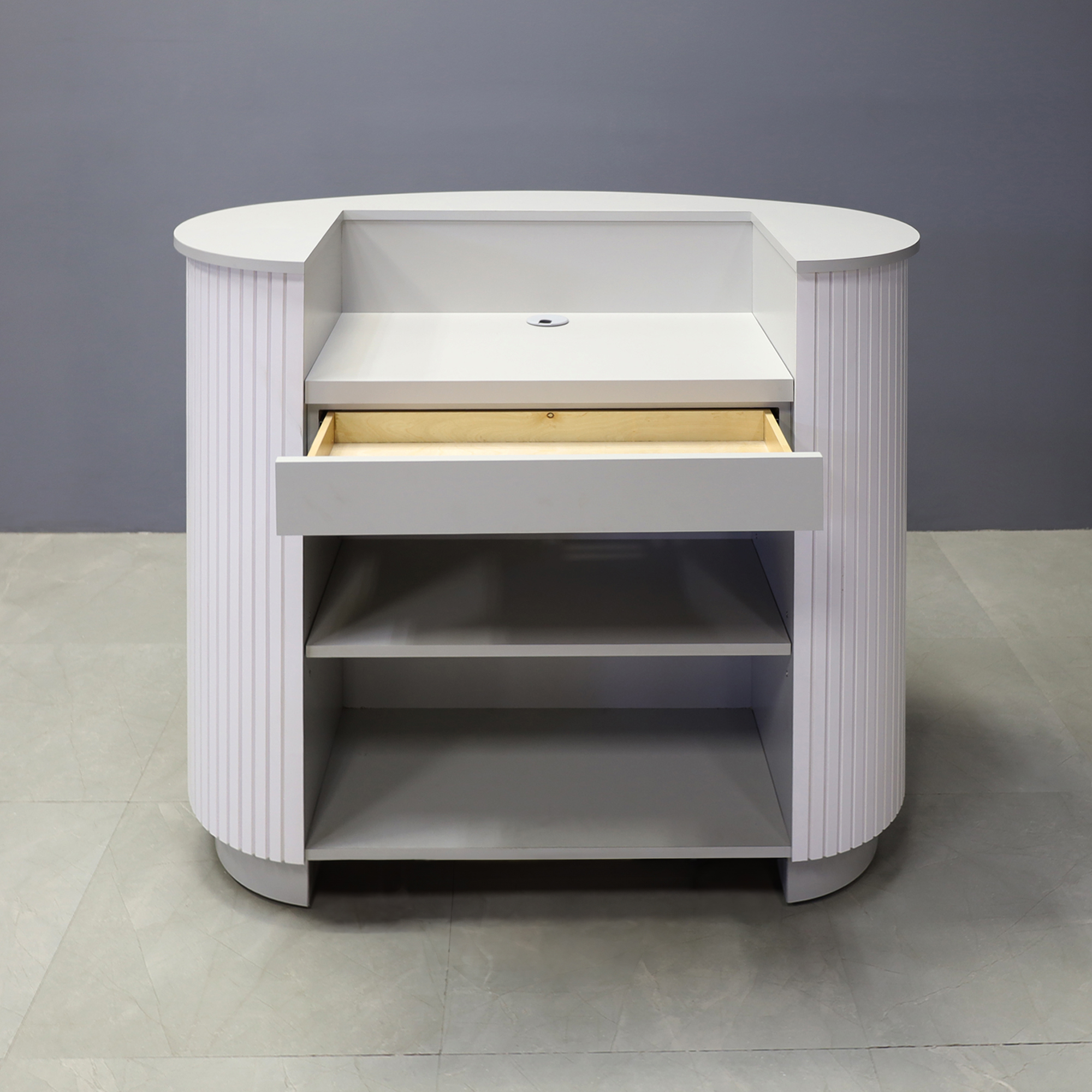 48-inch The Pill Podium & Host Custom Desk infolkstone gray matte laminate top counter, workspace and toe-kick, with white tambour front desk. Built-in pencil drawer and adjustable shelf, shown here.