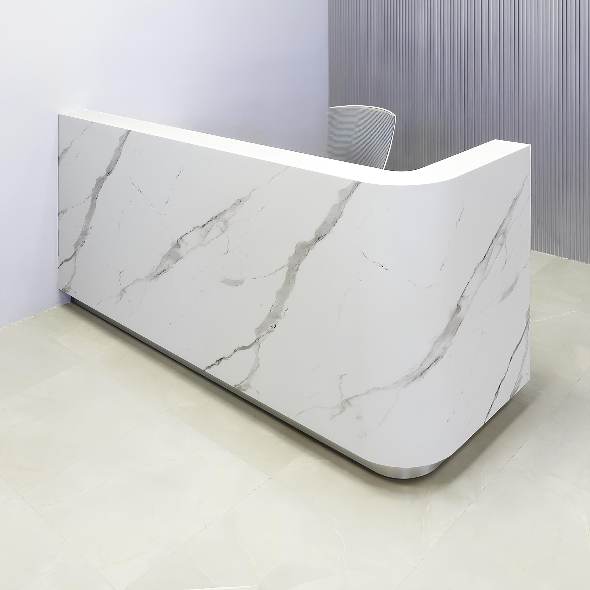 90-inch Nola L-Shape Custom Reception Desk with the l-panel on the right side. The main desk is covered in calcutta stone PVC, and the toe-kick in brushed aluminum.