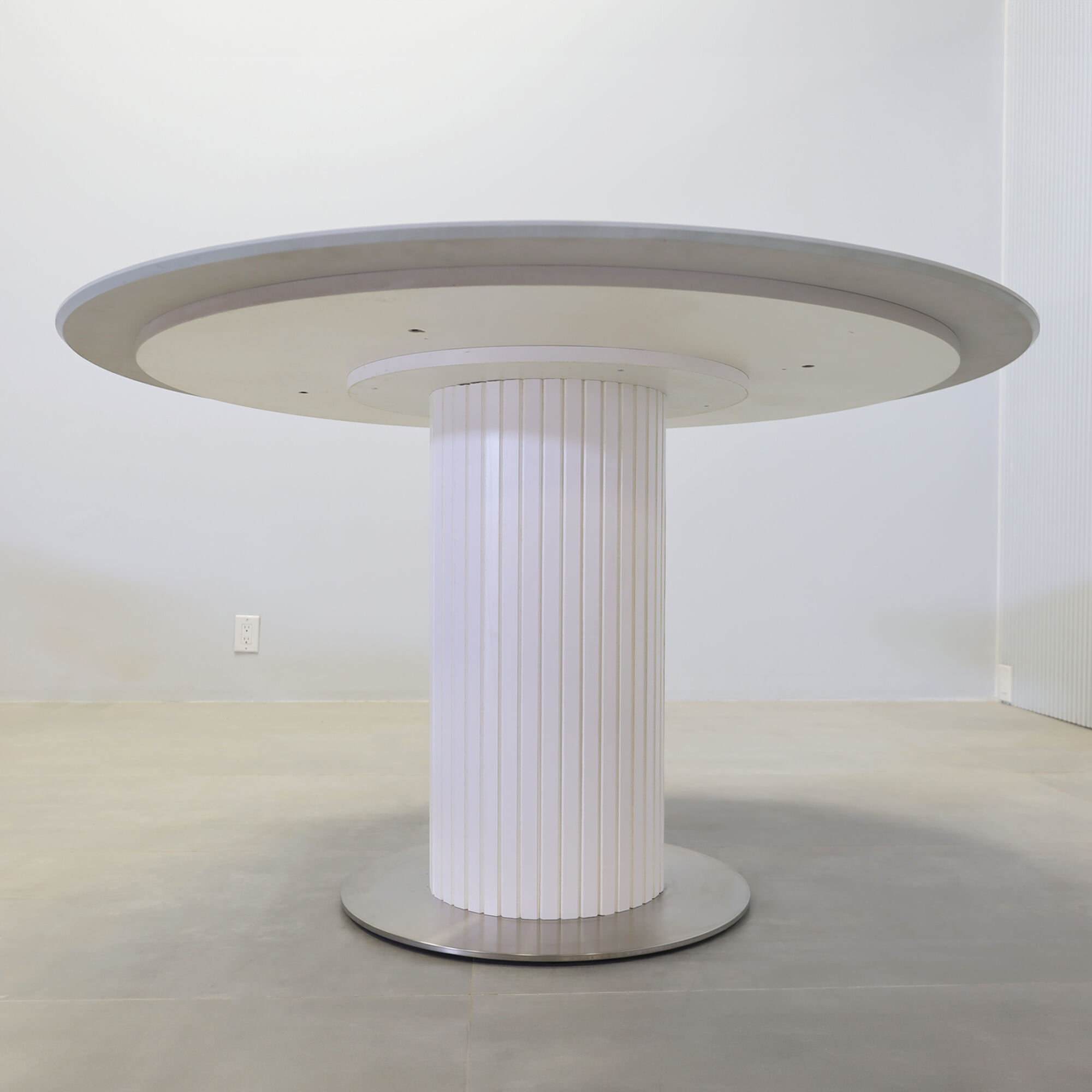 50-inch California X3 Round Conference table with light gray engineered surface top, white matte laminate tambour pedestal, silver stainless steel base, and MX1 power box.