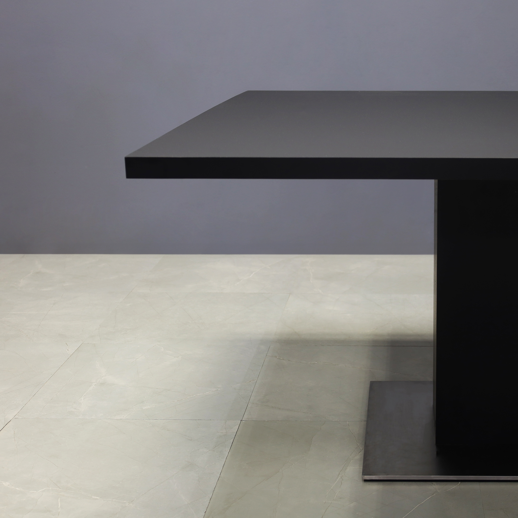 54-inch California Square Conference Table in black traceless laminate top and column, and silver stainless steel base, shown here.