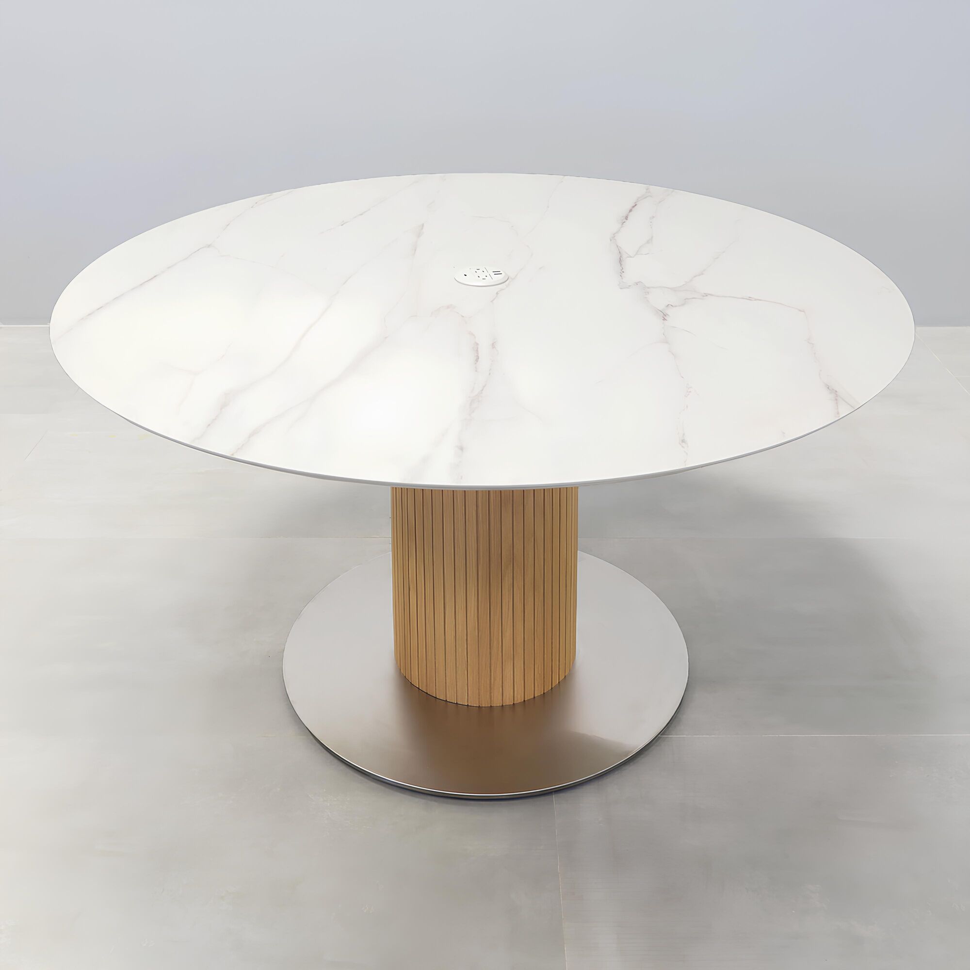 54-inches California X2 Round Conference Table with calcutta blanc engineered surface top, maple tambour pedestal, brushed stainless steel base, and Mx1 in white power box.