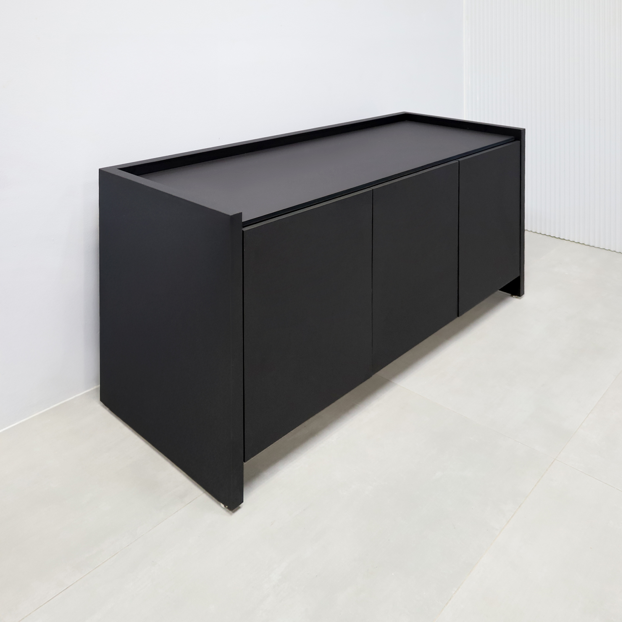 64-inch Aspen Storage Credenza with 1/2 black tracless engineered surface top, black traceless laminate credenza, and metropolitan concrete PVC inside.