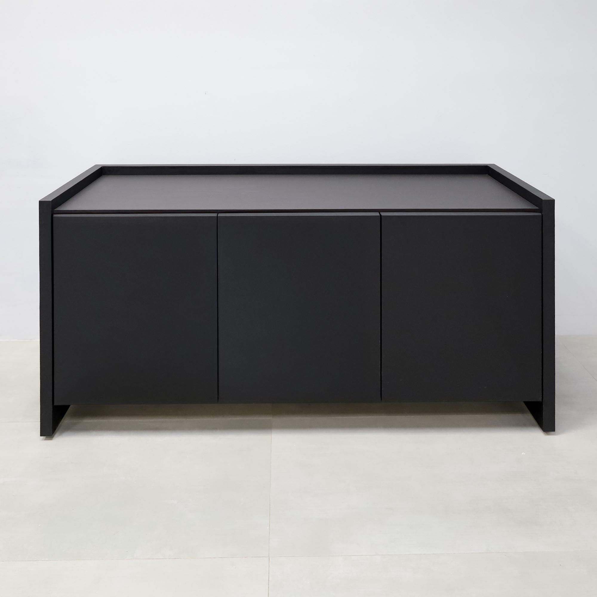64-inch Aspen Storage Credenza with 1/2 black tracless engineered surface top, black traceless laminate credenza, and metropolitan concrete PVC inside.