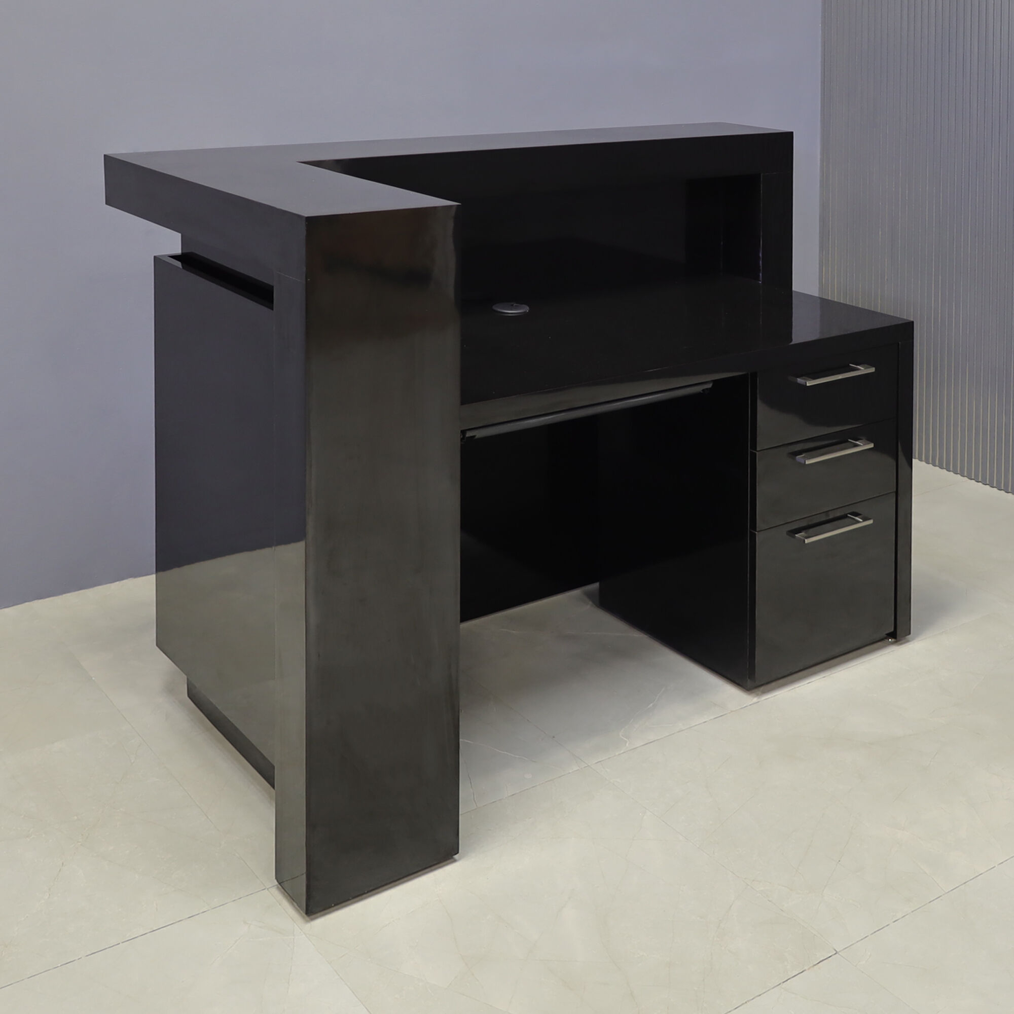 60-inch New York L-Shape Reception Desk in black gloss laminate main desk, front panel and accent recess, on the right side when facing front, and color changing LED. Built-in storage on the right side when sitting and one skinny pencil drawer.