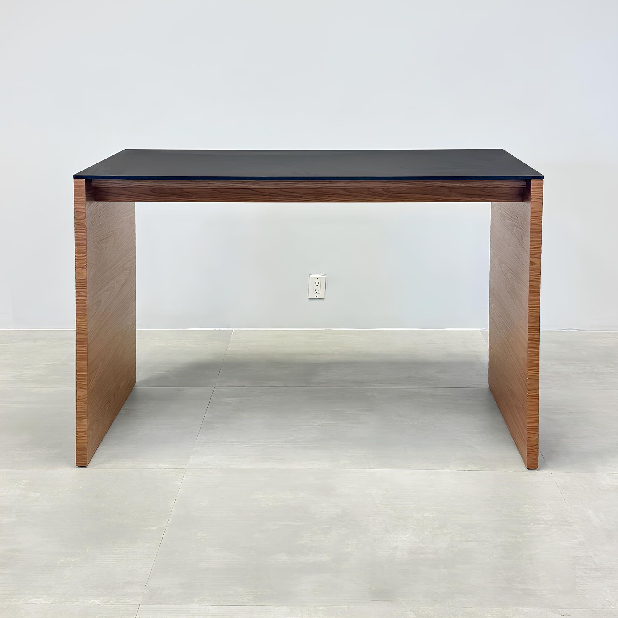 60-inch Ashville Bar Table with black, traceless laminate top and walnut wood veneer base.