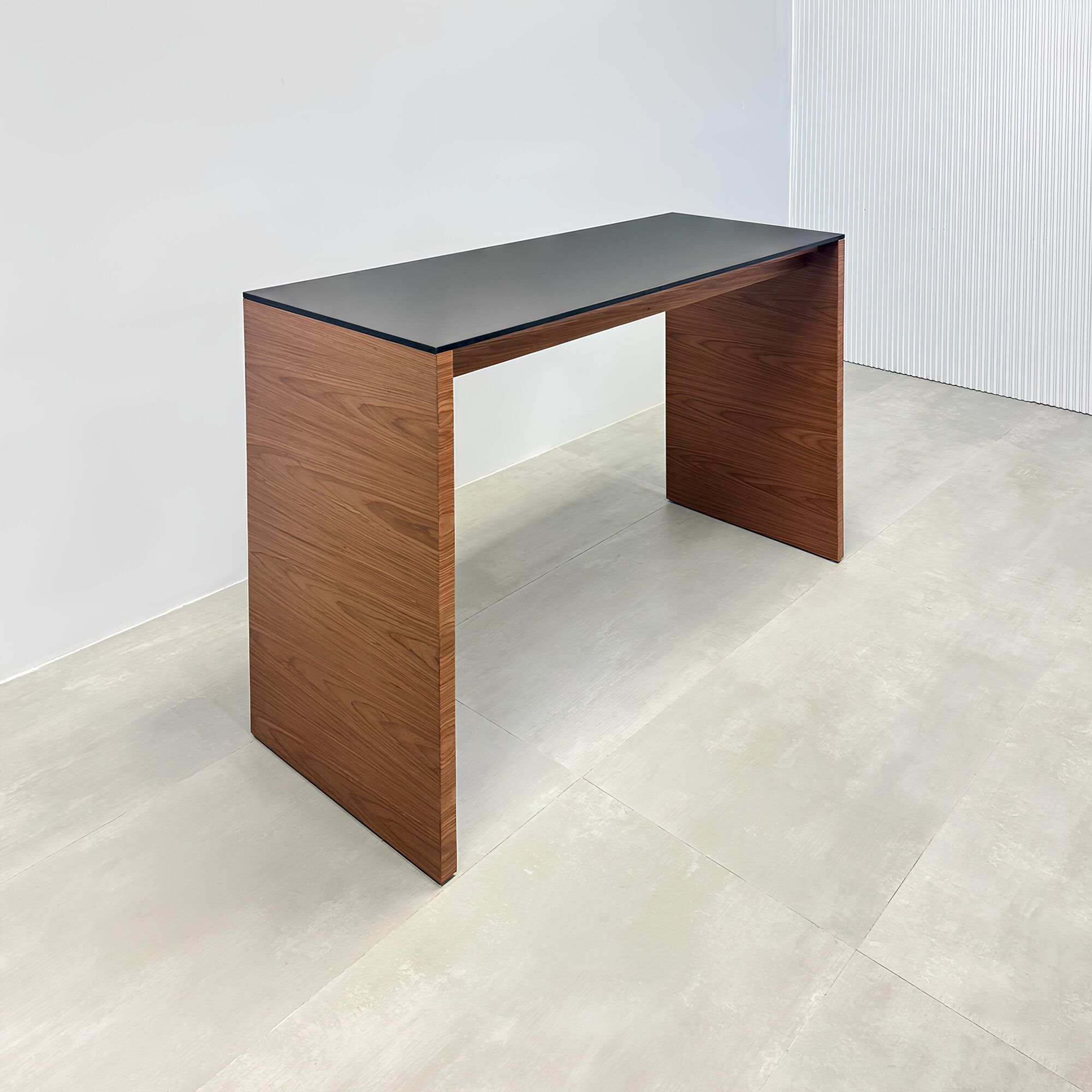60-inch Ashville Bar Table with black, traceless laminate top and walnut wood veneer base.