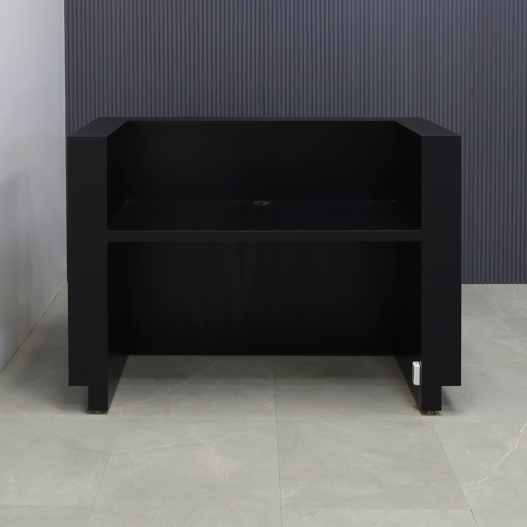 60 inches Black Traceless laminate finish desk and black matte laminate finish toe-kick, with multi-colored LED, seating side view shown here.