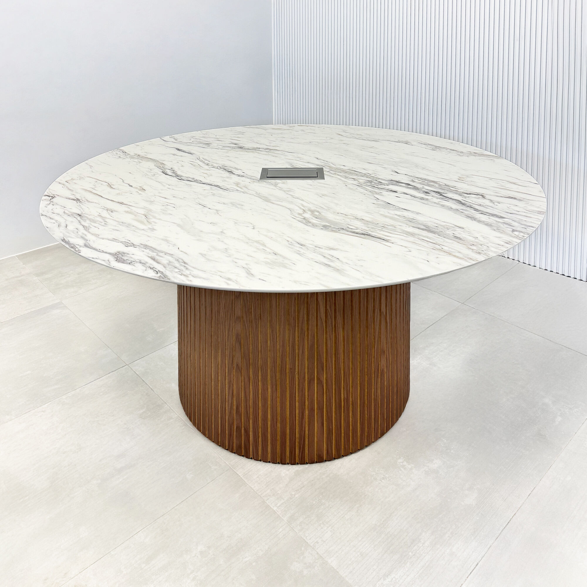60-inch Aurora Round Conference Table with calcutta blanc engineered surface top, walnut tambour & natural background base and MX3 power box in silver.
