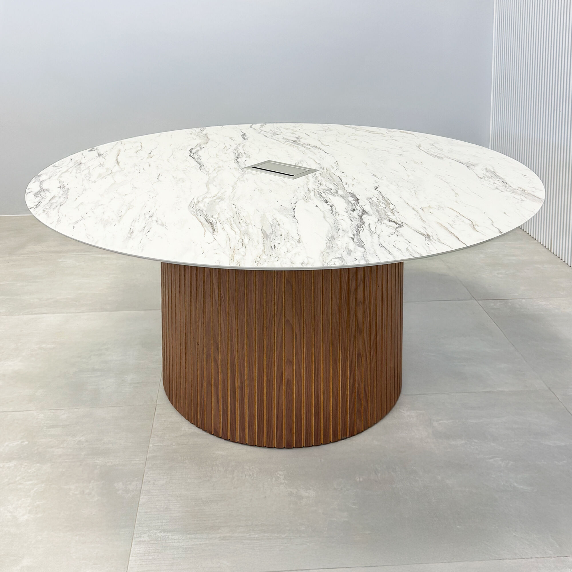 60-inch Aurora Round Conference Table with calcutta blanc engineered surface top, walnut tambour & natural background base and MX3 power box in silver.