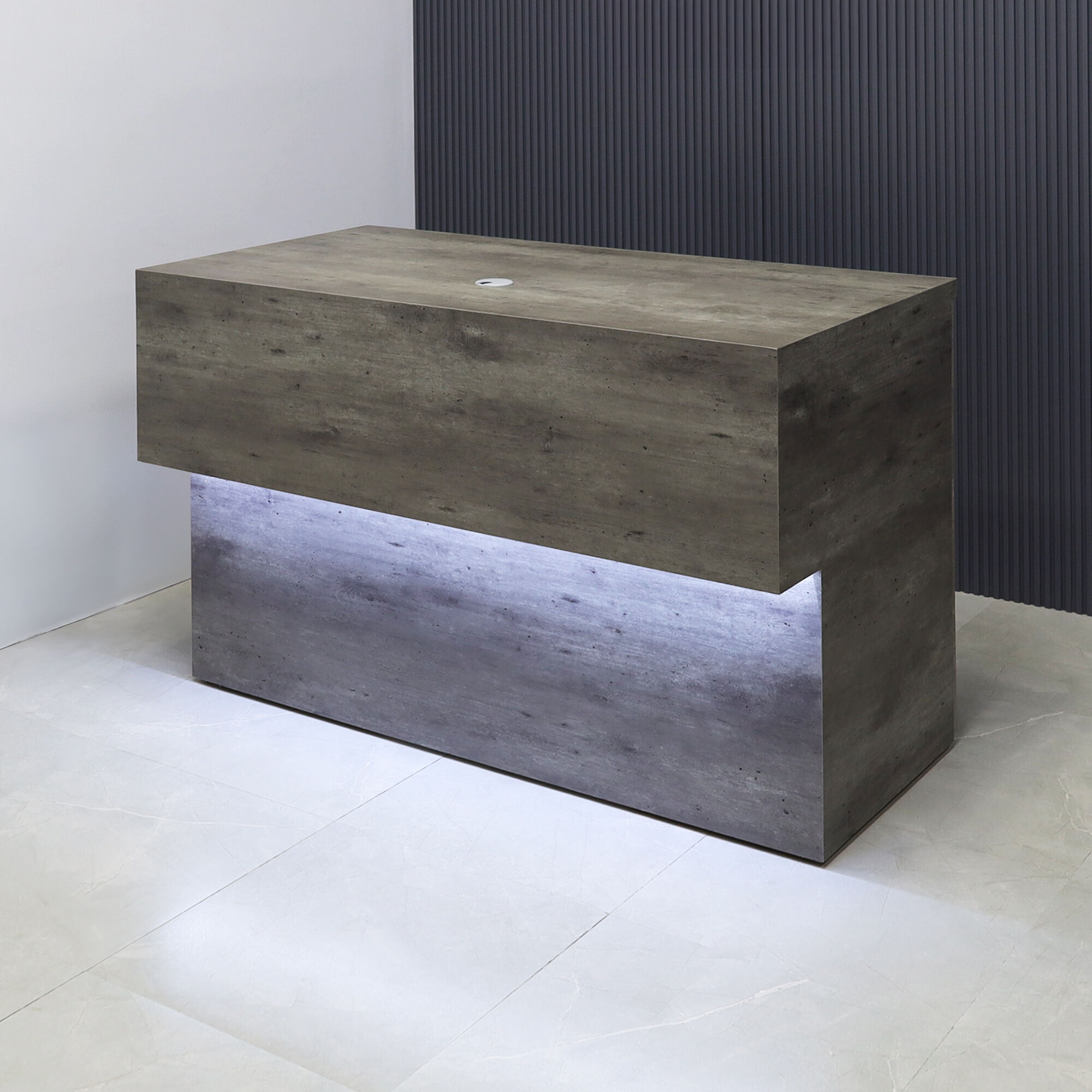 60-inch Atlanta Base Reception Desk in concrete laminate main desk and warm white LED.
