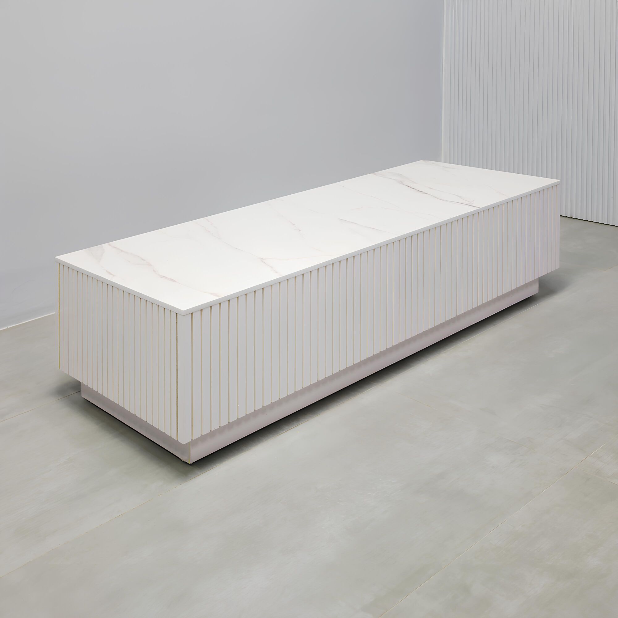 60-inch Norfolk Rectangular Lobby Table with solenne engineered surface top, white gloss tambour side table, and white gloss laminate toe-kick.