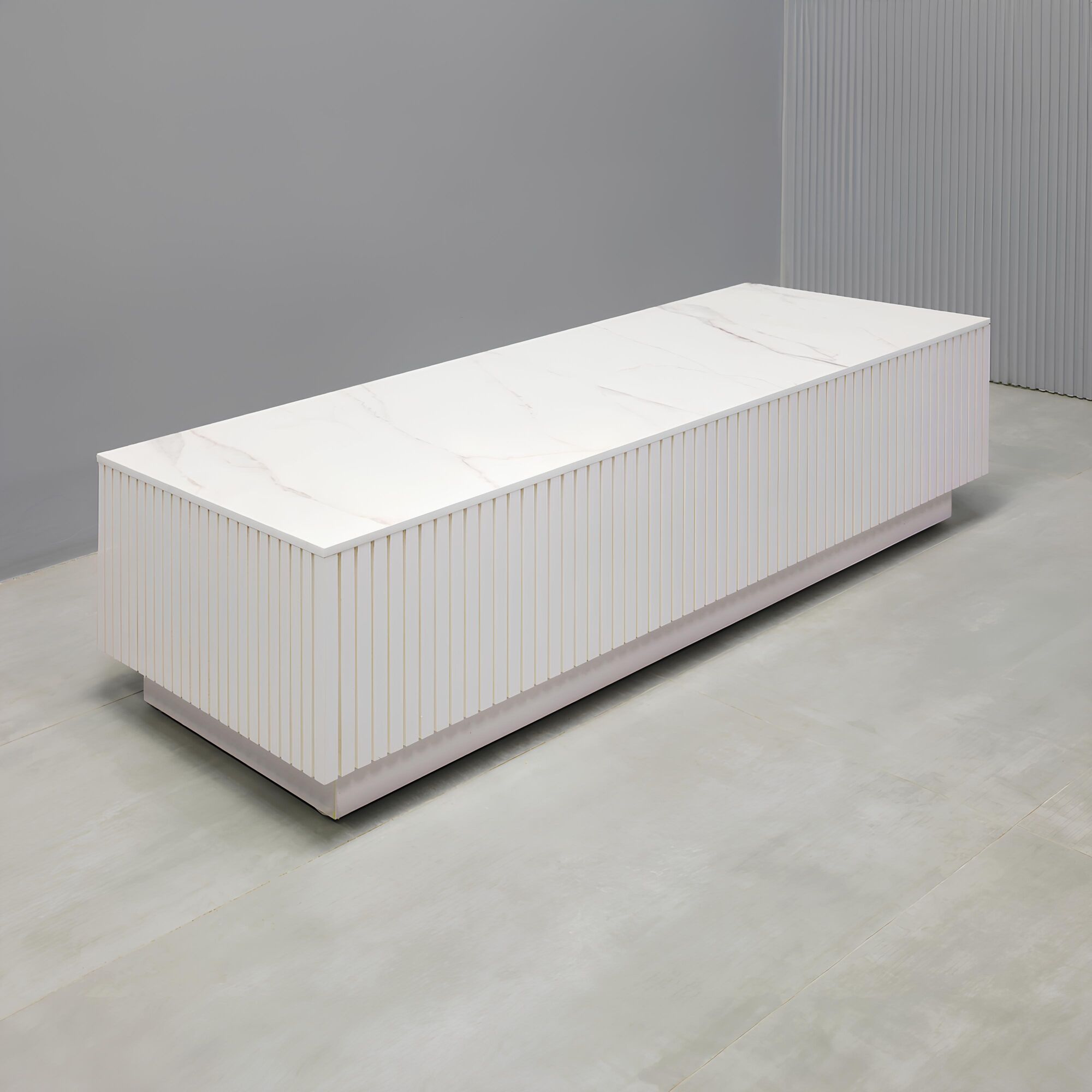 Norfolk Rectangular Lobby Table in solenne engineered surface top, white gloss tambour side table, and white gloss laminate toe-kick.